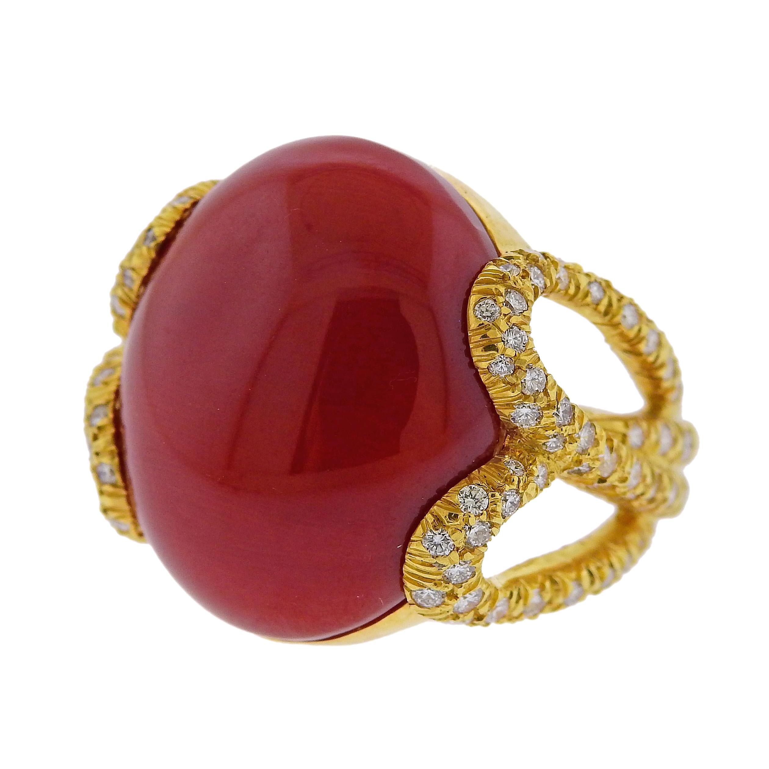 Beautiful 18k yellow gold ring by Henry Dunay, set with a 21mm x 18mm oxblood red coral, surrounded with approx. 0.80ctw in G/VS diamonds. Ring size is 6.5, ring top of the ring is 21mm wide. Weight: 16.1 grams. Marked: Dunay, 18kt, 750, E2826.