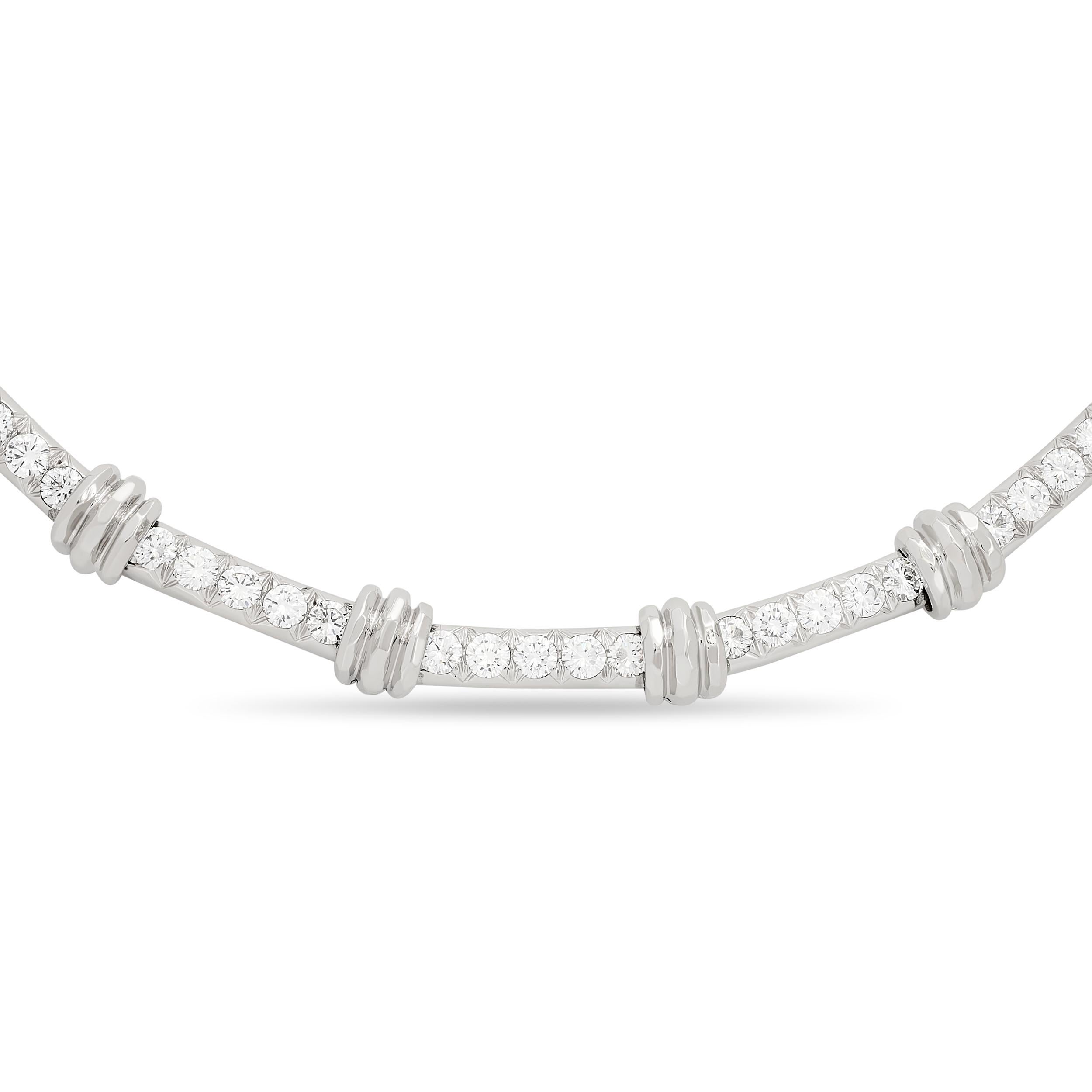 An elegant Henry Dunay necklace with a touch of mesmerizing brilliance. This listing is for the necklace only; the matching bracelet is a separate listing.

The necklace, made in platinum, has 25 round brilliant diamonds that weigh approximately