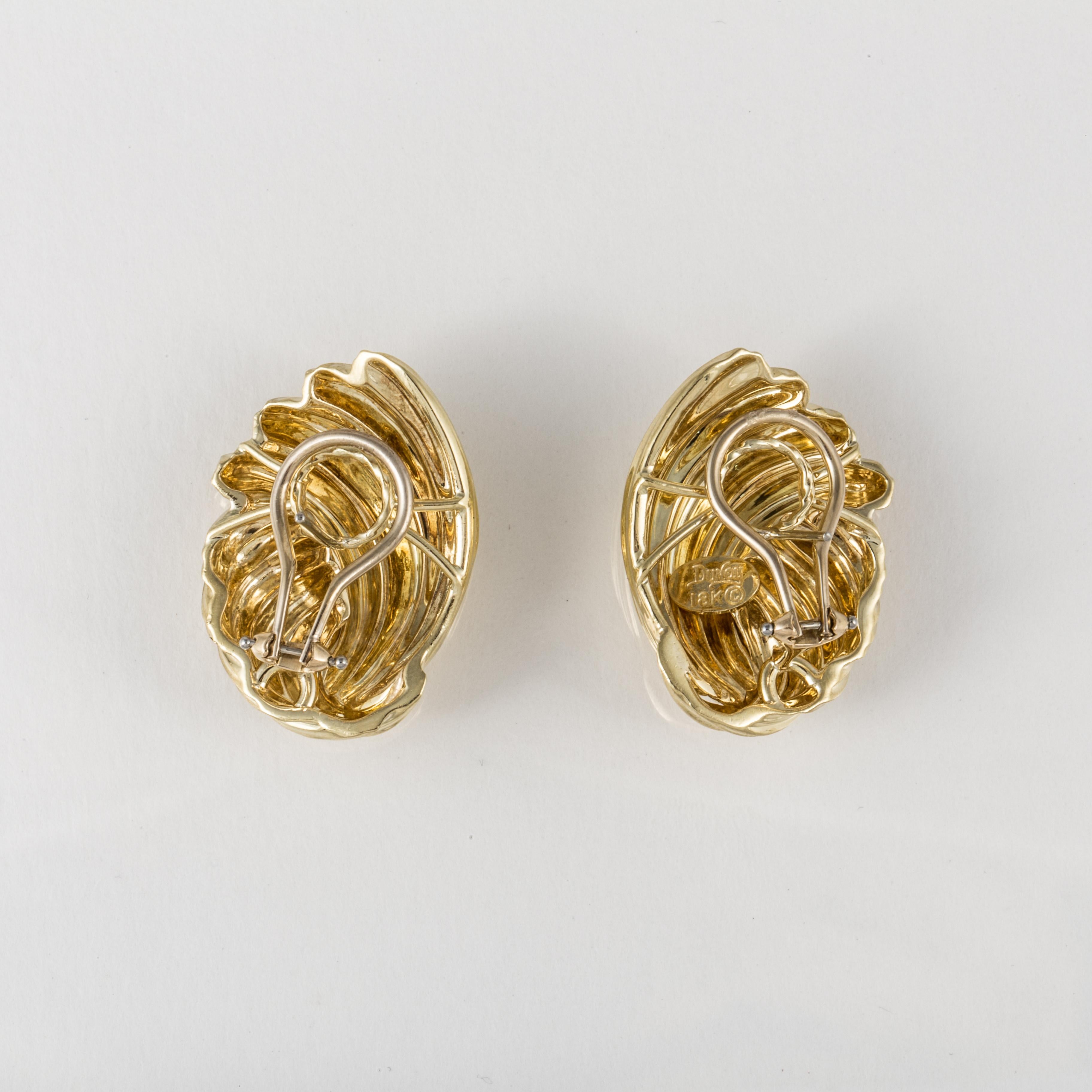 Henry Dunay earrings in 18K yellow gold with a polished finish.  They measure 1 5/16 inches long and 7/8 inches wide.  These are for pierced ears with a post and lever back.