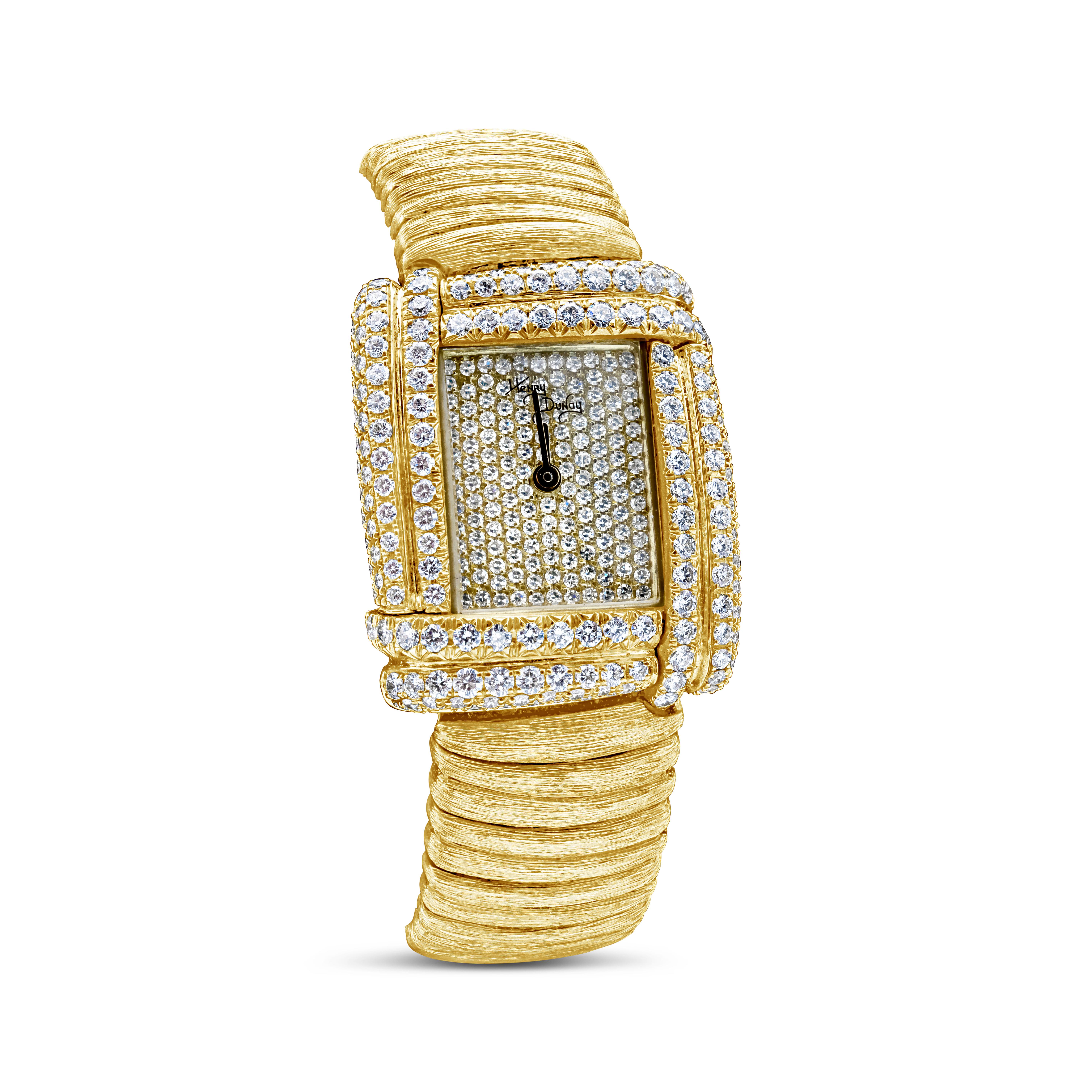 This beautiful watch is encrusted with 216 brilliant round diamonds. Diamonds weighing 2.40 carats total, E-F color and VS clarity. Made in 18 karat yellow gold. Approximately 116 grams