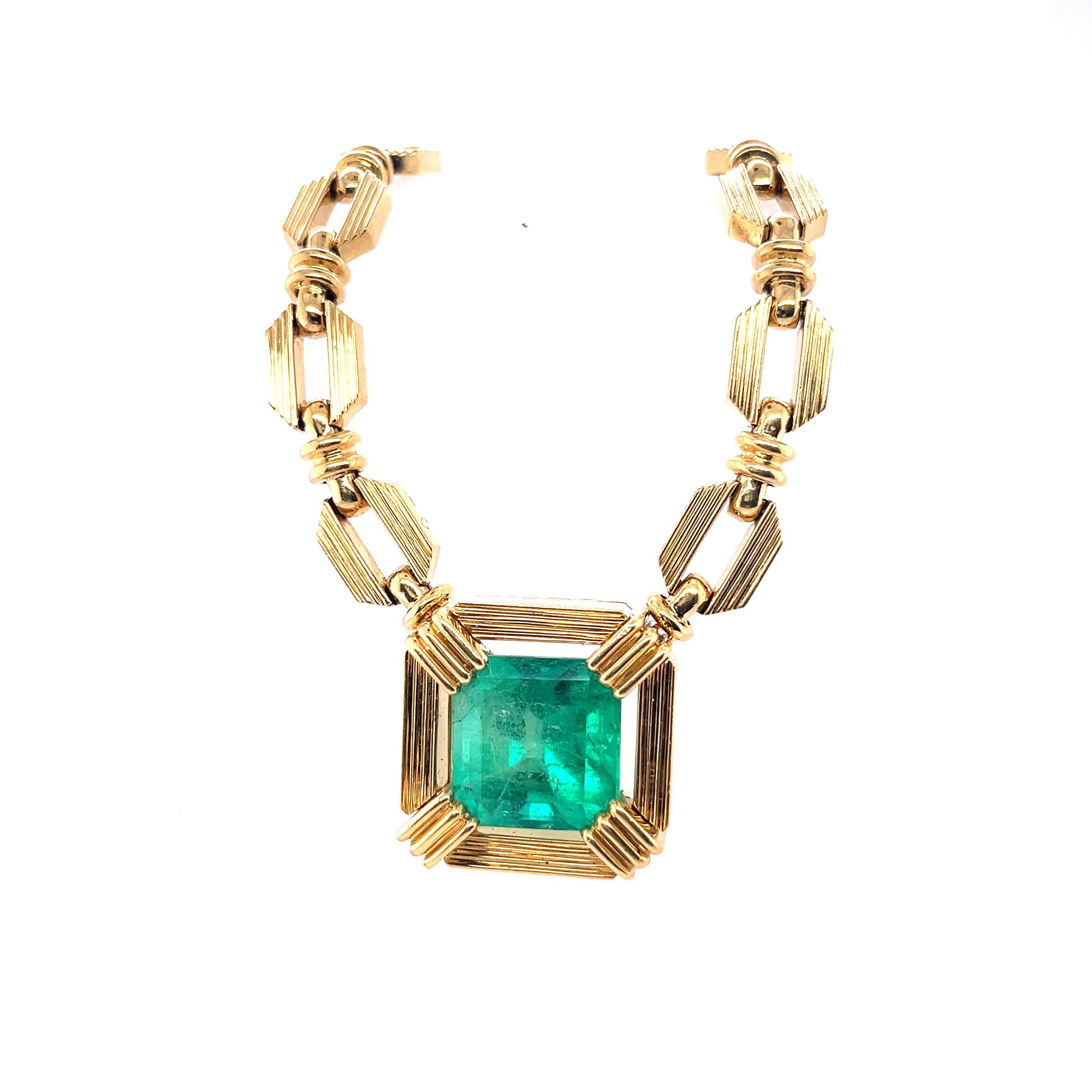 The prominent Polish-American designer, Henry Dunay, fashioned this 19.48 carat Colombian Emerald set in 18 karat solid yellow gold. The Emerald radiates vibrant vivid green color hues. At almost 20 carats, an Emerald of this size to have such