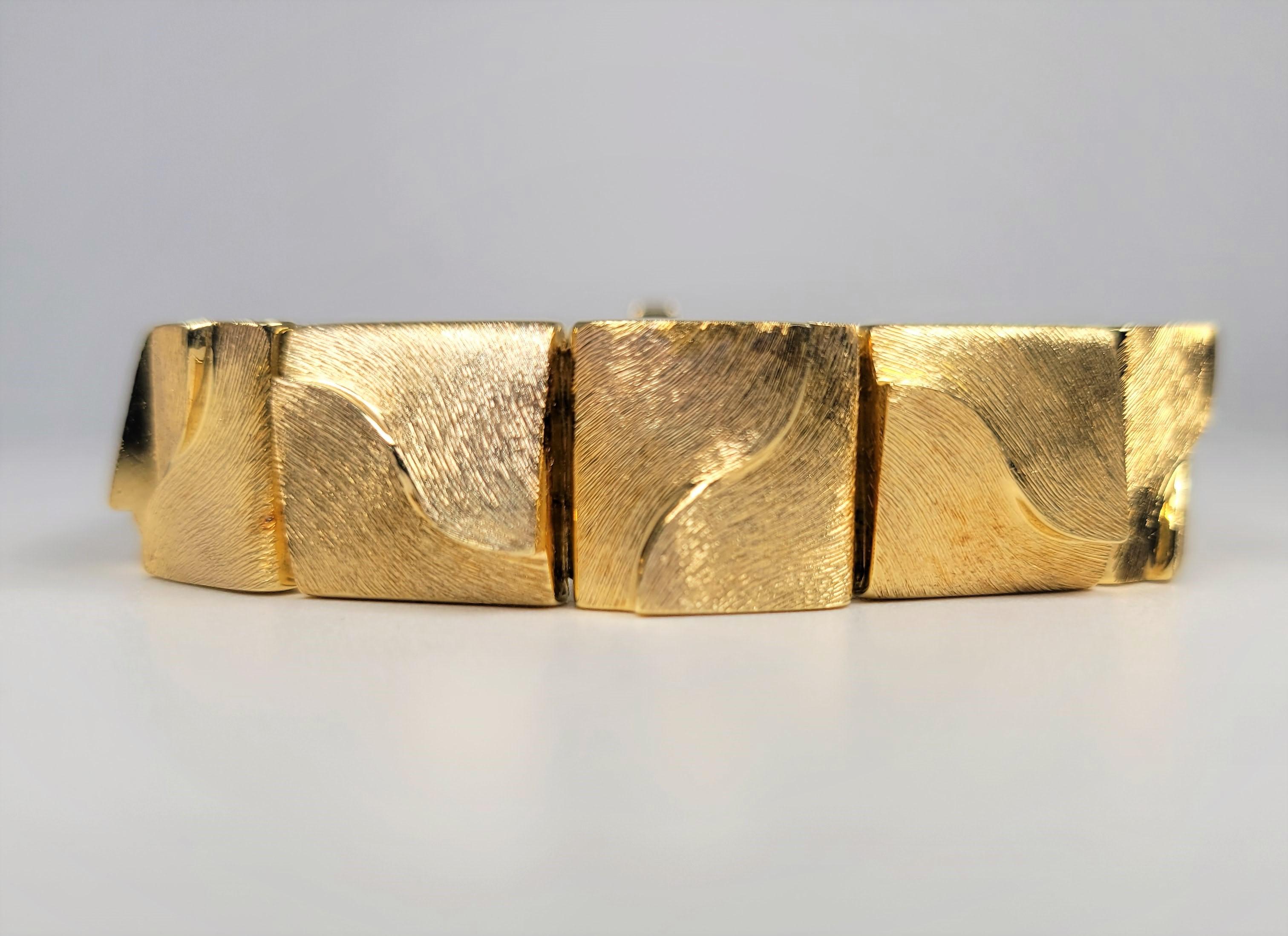 Such a timeless design from Henry Dunay!  In 18 karat textured and highly polished yellow gold.  A treasure for sure!