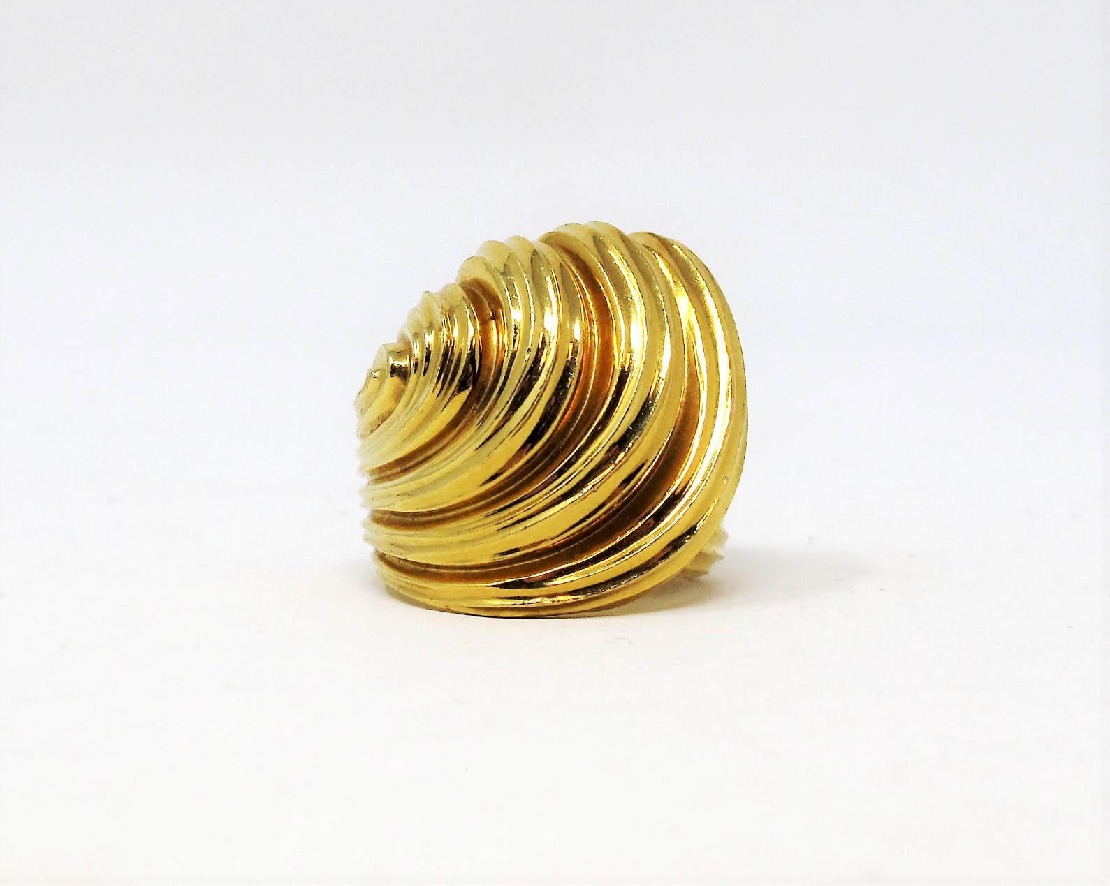 Ring size: 6.5

Uniquely textured 18 karat yellow gold cocktail ring by American jewelry designer, Henry Dunay. Bold in both size and design, this substantial dome ring offers stunning sophistication without being over the top, while the sleek