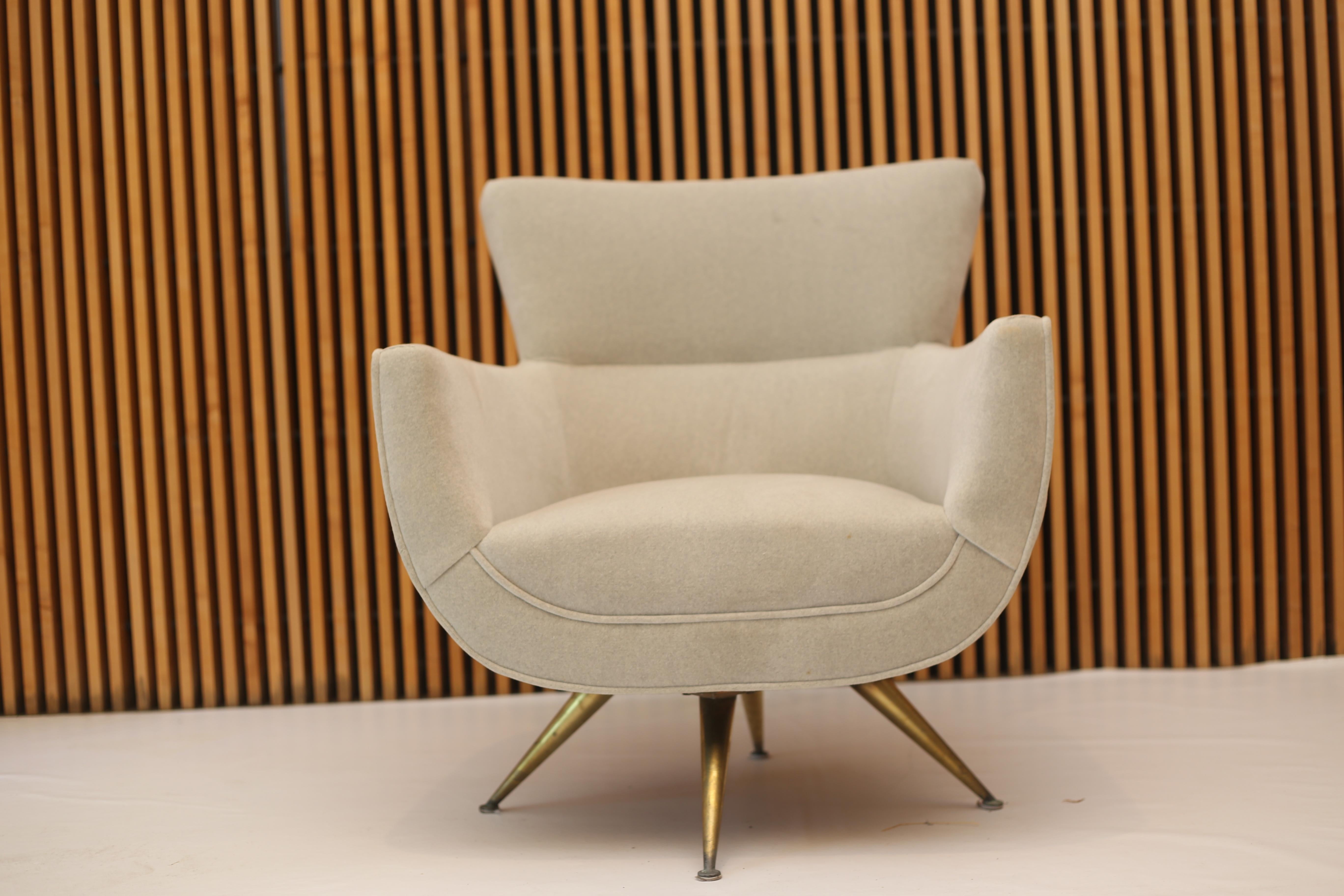 A rare example from Henry Glass for Forcast Furniture dating to the mid-1950s. Reupholstered in a neutral velvet fabric and on a swivel base with splayed brass legs.