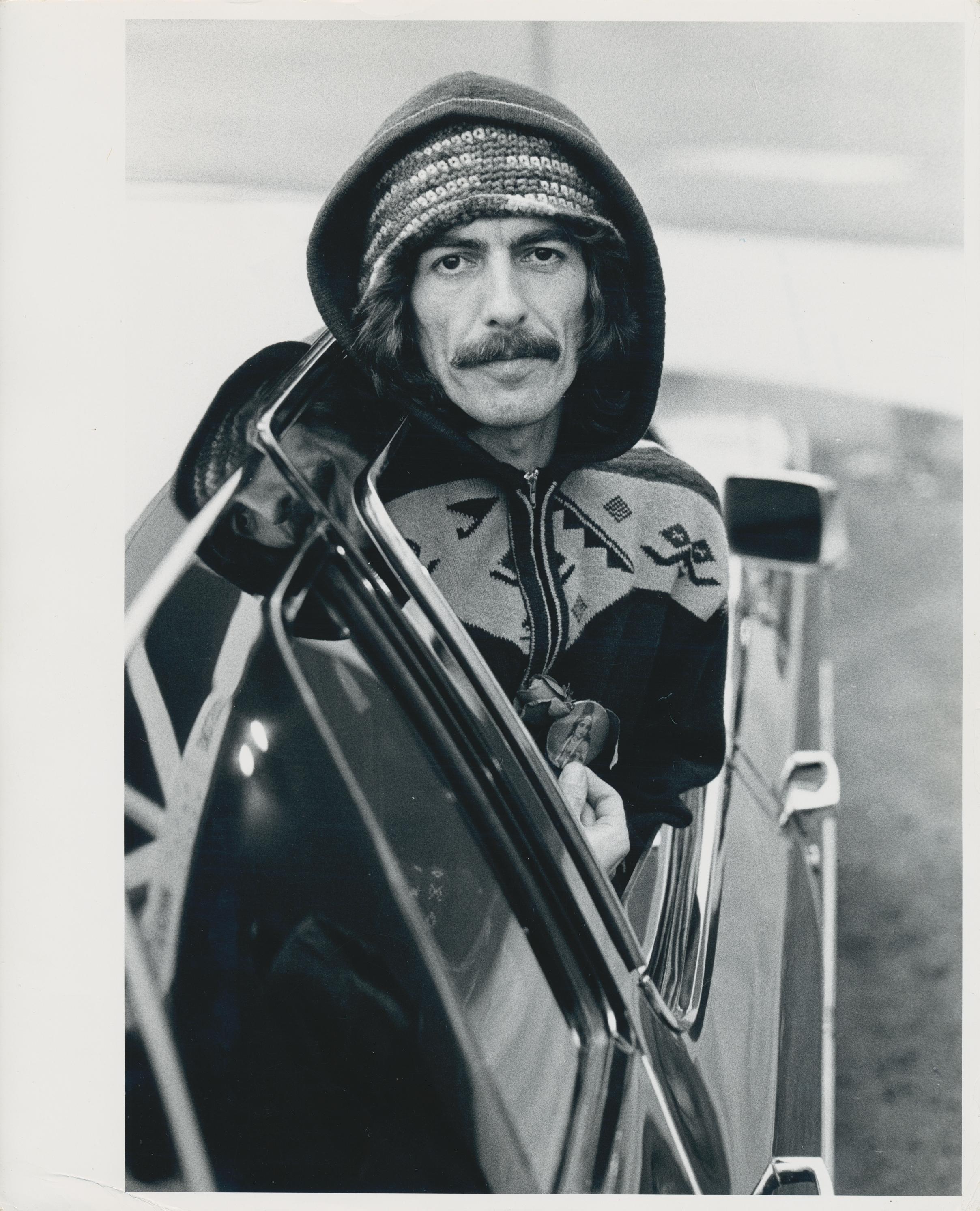 Henry Grossman Portrait Photograph - George Harrison in Car, Black and White Photography, 25, 4 x 20, 6 cm