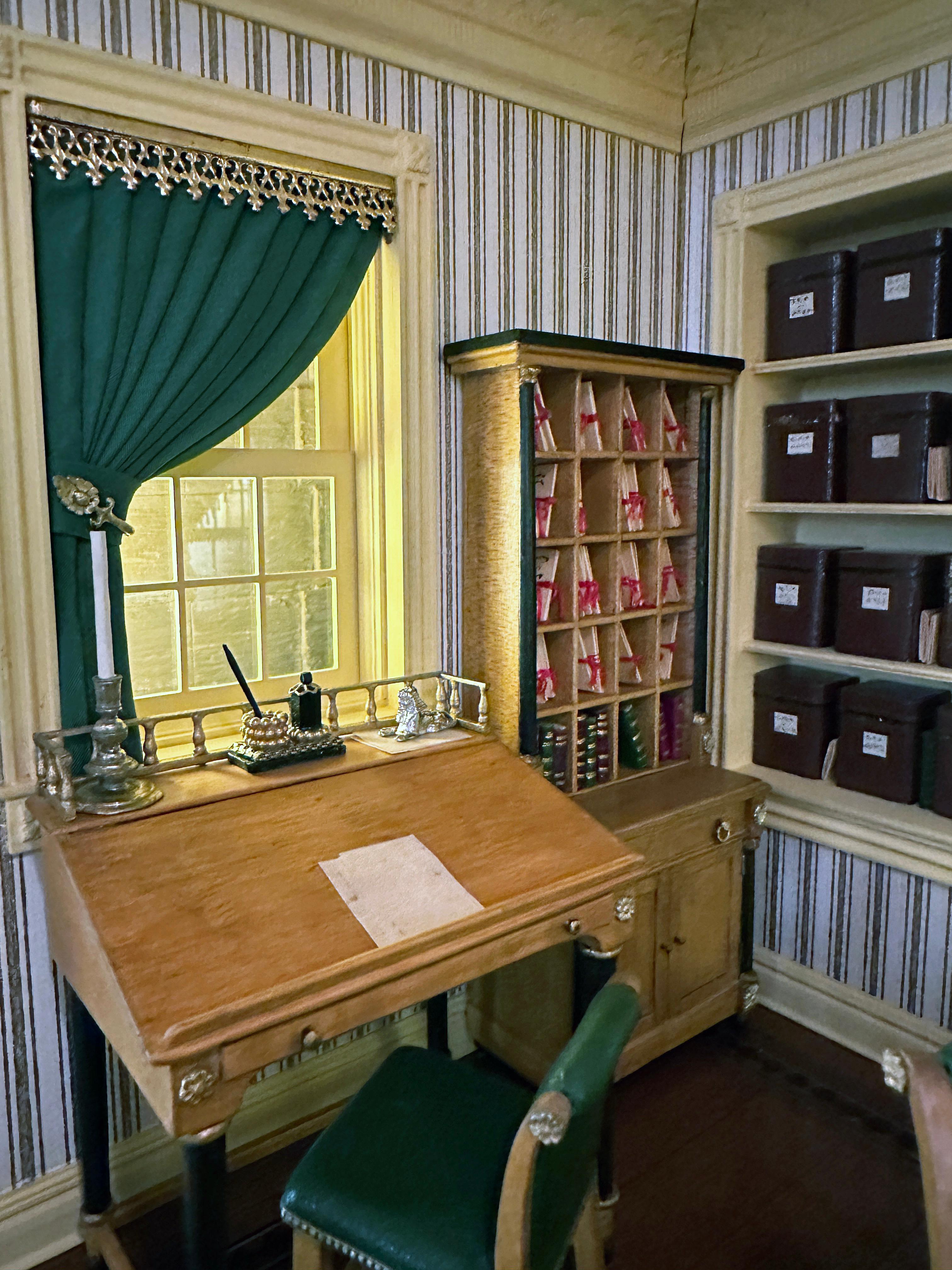 The details are so painstakingly exact that the viewer is deceived into believing they are viewing a full scale replica of a lawyer's office from 1885. 
 The Kupjack Studios are masters of the miniature world.  From the smallest of details such as