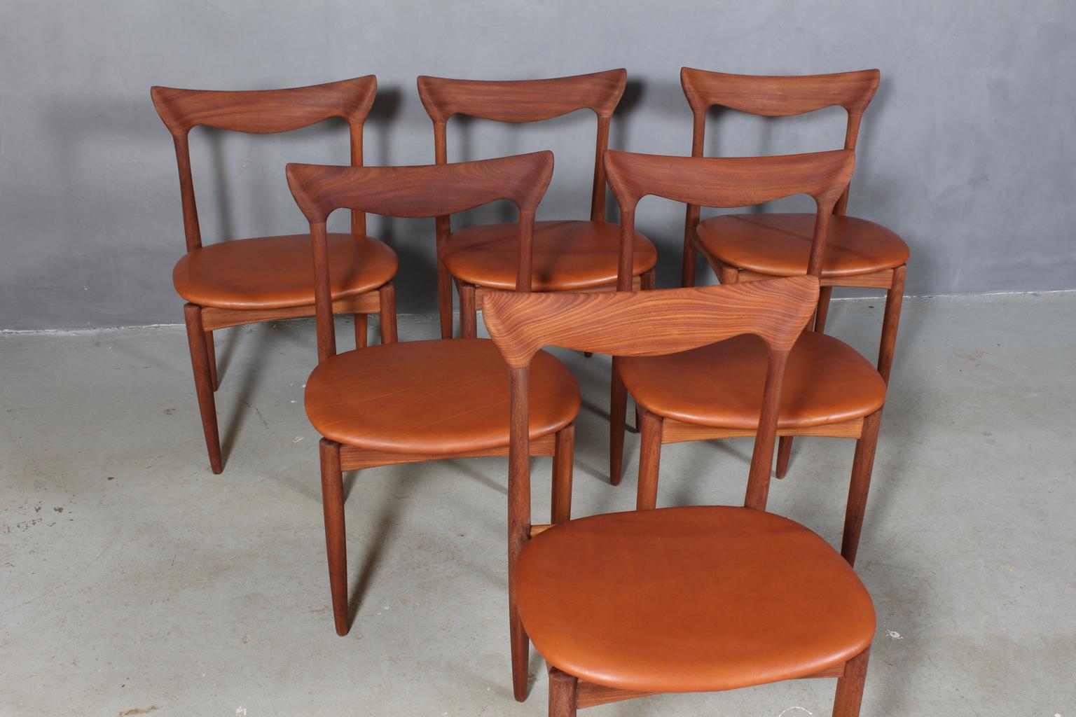Henry Walter Klein six dining chairs in massive teak.

New upholstered with cognac aniline leather.

Made by Bramin, 1960s.
