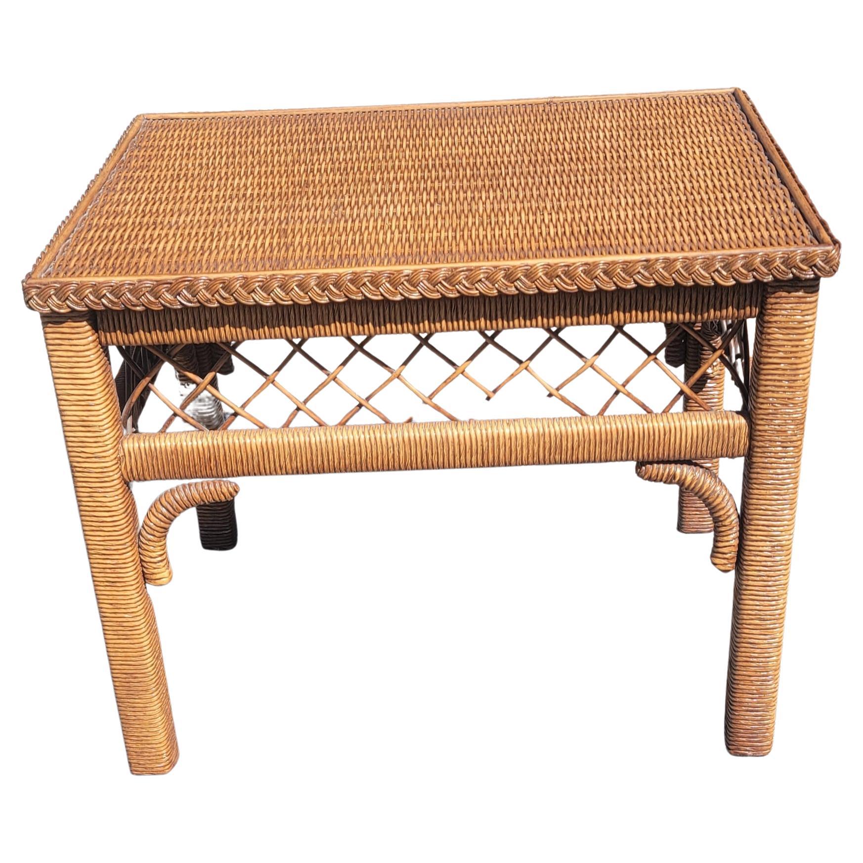 Gorgeous bohemian style rectangular side table by Henry link. 
Table features woven wicker and rattan frame with a glass top and measures 19