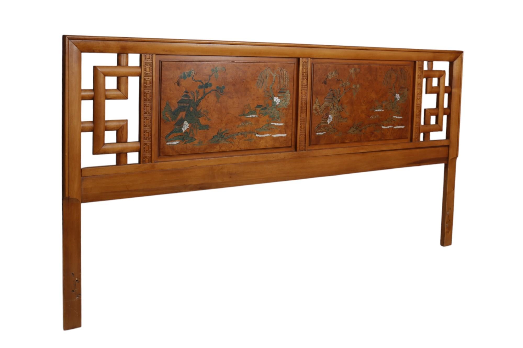 A Chinoiserie king size headboard attributed to Henry Link Furniture. Central panels with burlwood veneers are hand-painted with Asian river scenes in gold with white and black detailing. Each side is finished with a fretwork carved border and