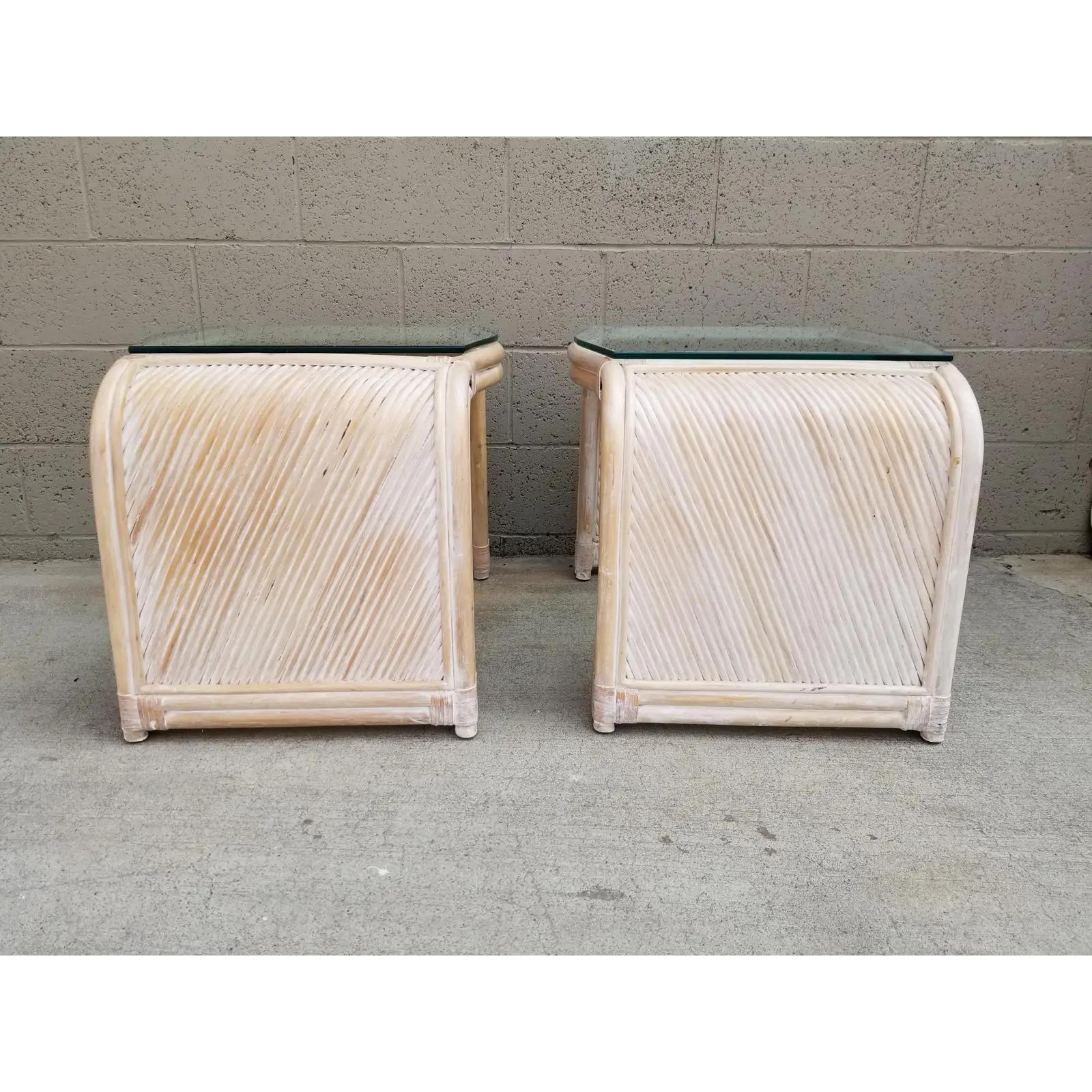 Henry Link split reed and bamboo end tables with glass tops. Bindings are done with leather. Original white-wash finish. Late 20th century. Scratches faint water ring to glass top.

Henry Link:
Henry Talmadge Link (b.1889 d.1983) had been a