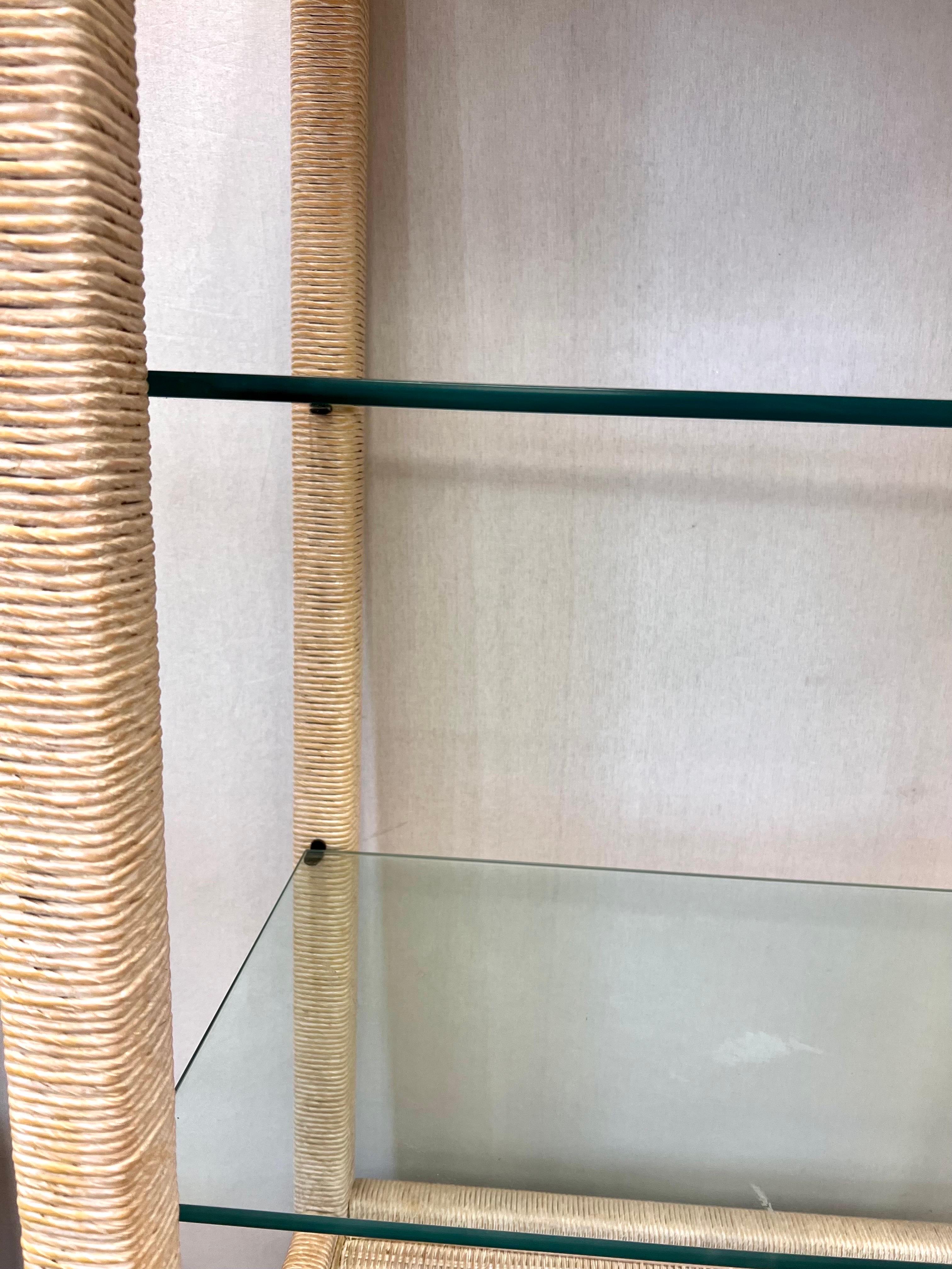 Henry Link wicker wrapped bookcase etagere with a whitewashed finish. Top has glass shelves. Bottom part has three drawers.
See our other listings for two more etageres.