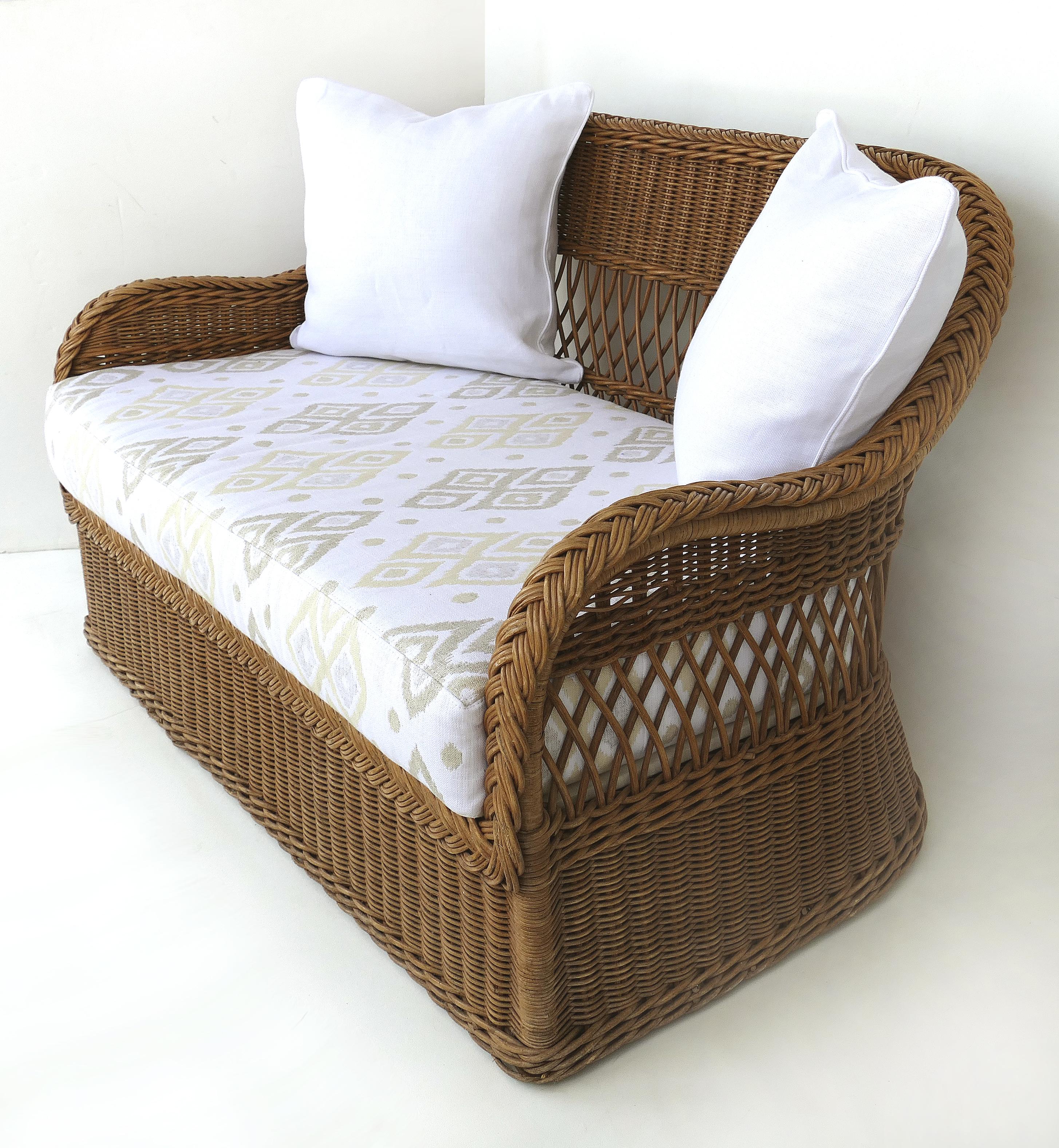 Henry link woven wicker loveseat settee, newly upholstered

Offered for sale is a fine quality Henry Link natural woven wicker settee or loveseat with a loose seat cushion which is newly upholstered. The settee will be accompanied by two square