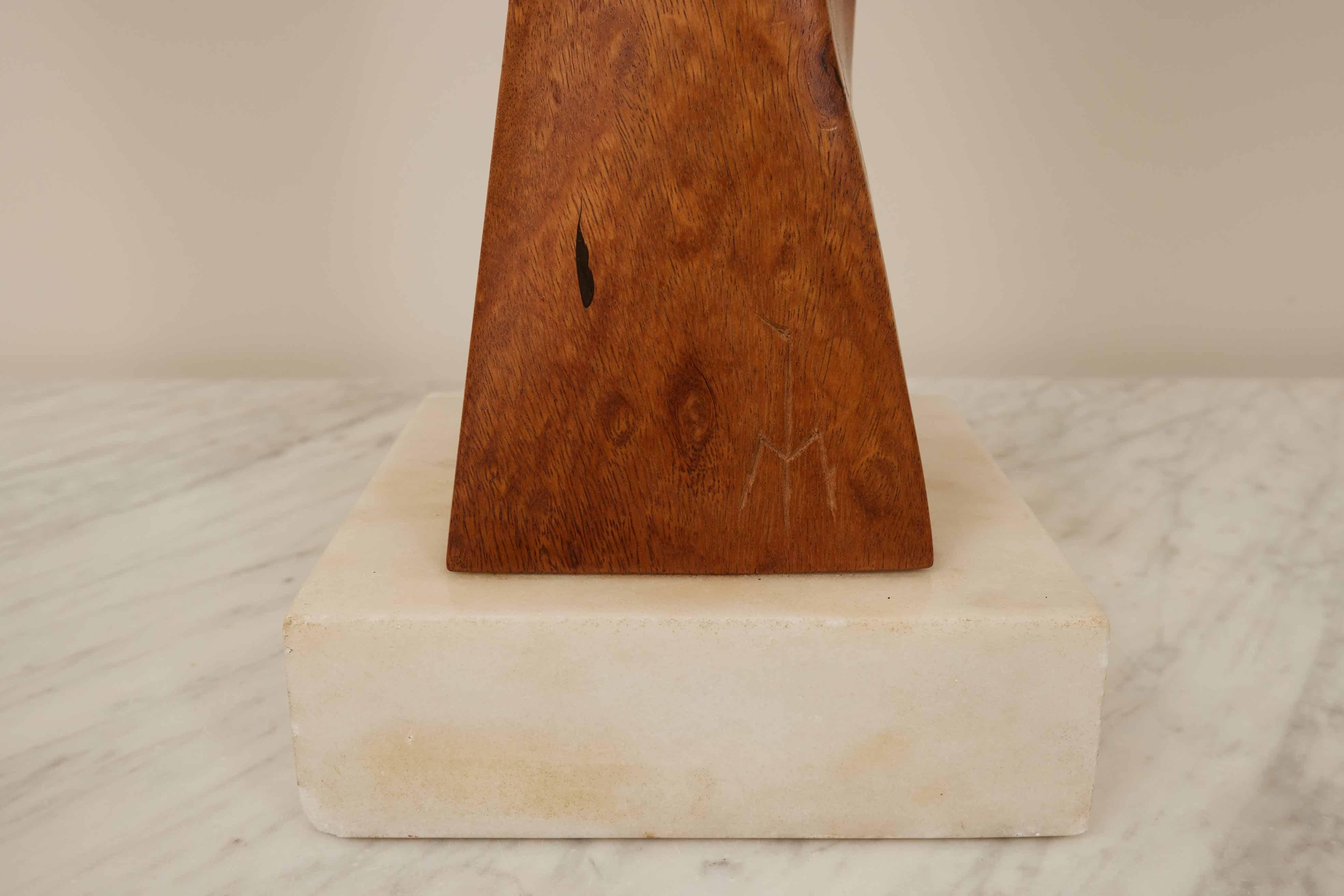 Henry Moretti Mahogany Sculpture  1970s

Discover this striking large mahogany sculpture by Henry Moretti, a renowned French sculptor who found his artistic liberation in the USA post-war. Born in 1913 and passing in 2015, Moretti's career spanned