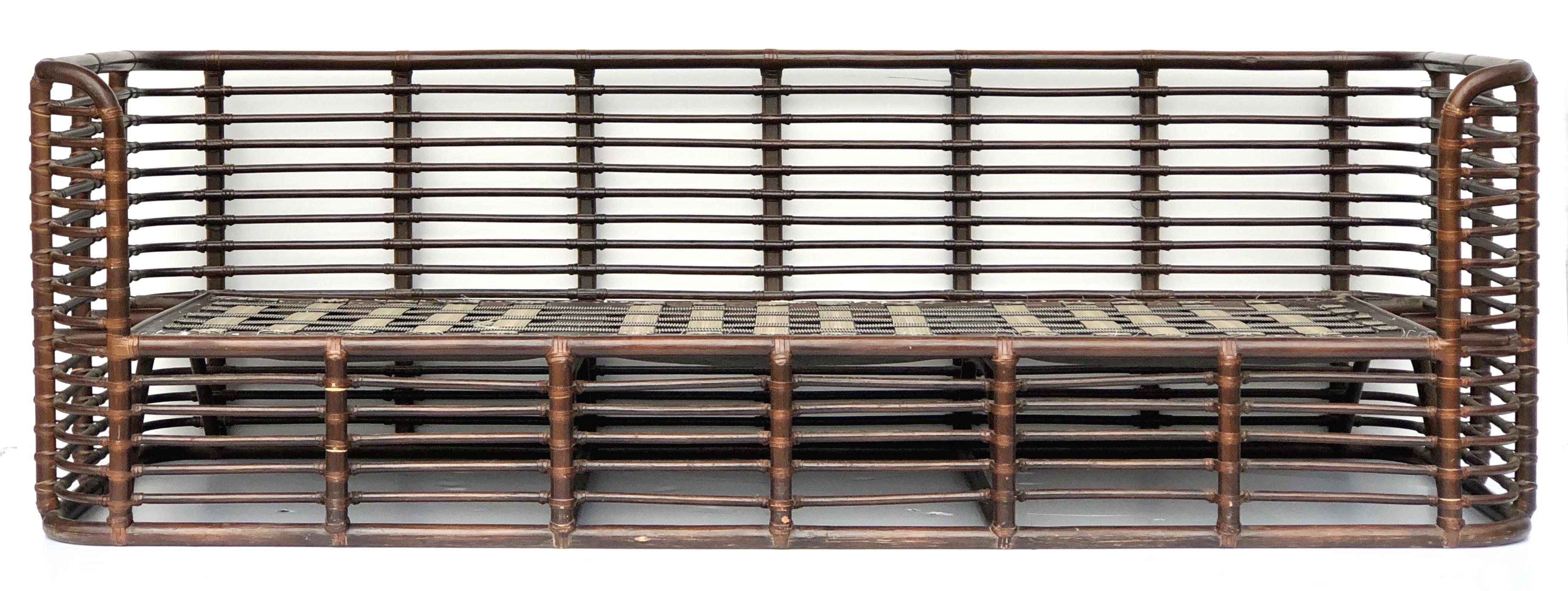 Henry Olko 1970s rattan sofa with velvet upholstery

Offered for sale is a vintage circa 1970s sculptural Henry Olko rattan and leather-wrapped sofa with loose cushions upholstered in velvet fabric. The sofa has been recovered in a stripe pattern