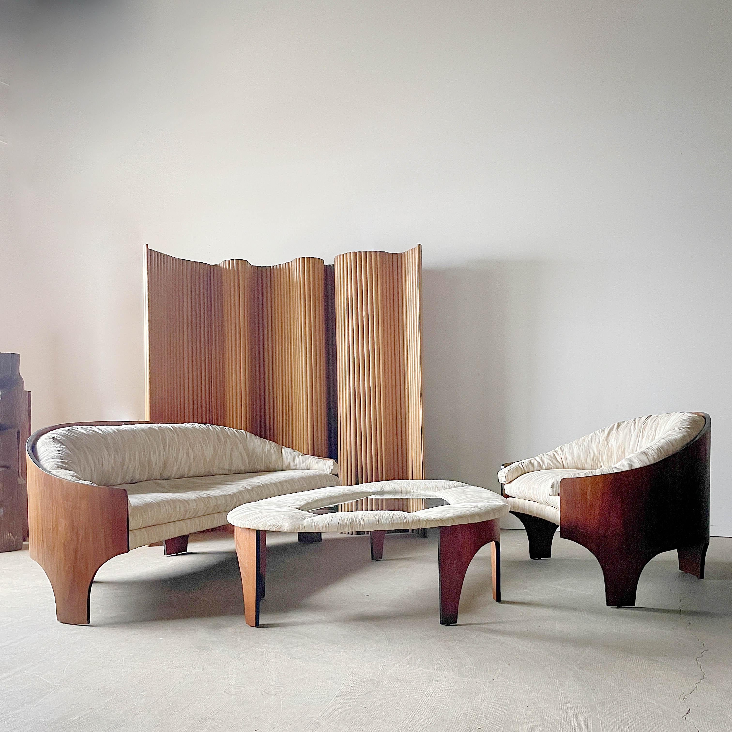 Rare molded plywood suite designed by legendary Henry P. Glass and made by Deco House in the 1960s. Featuring a unique leg profile and curved walnut plywood backs, this set of Glass designed furniture is incredibly modern and eye catching. Glass