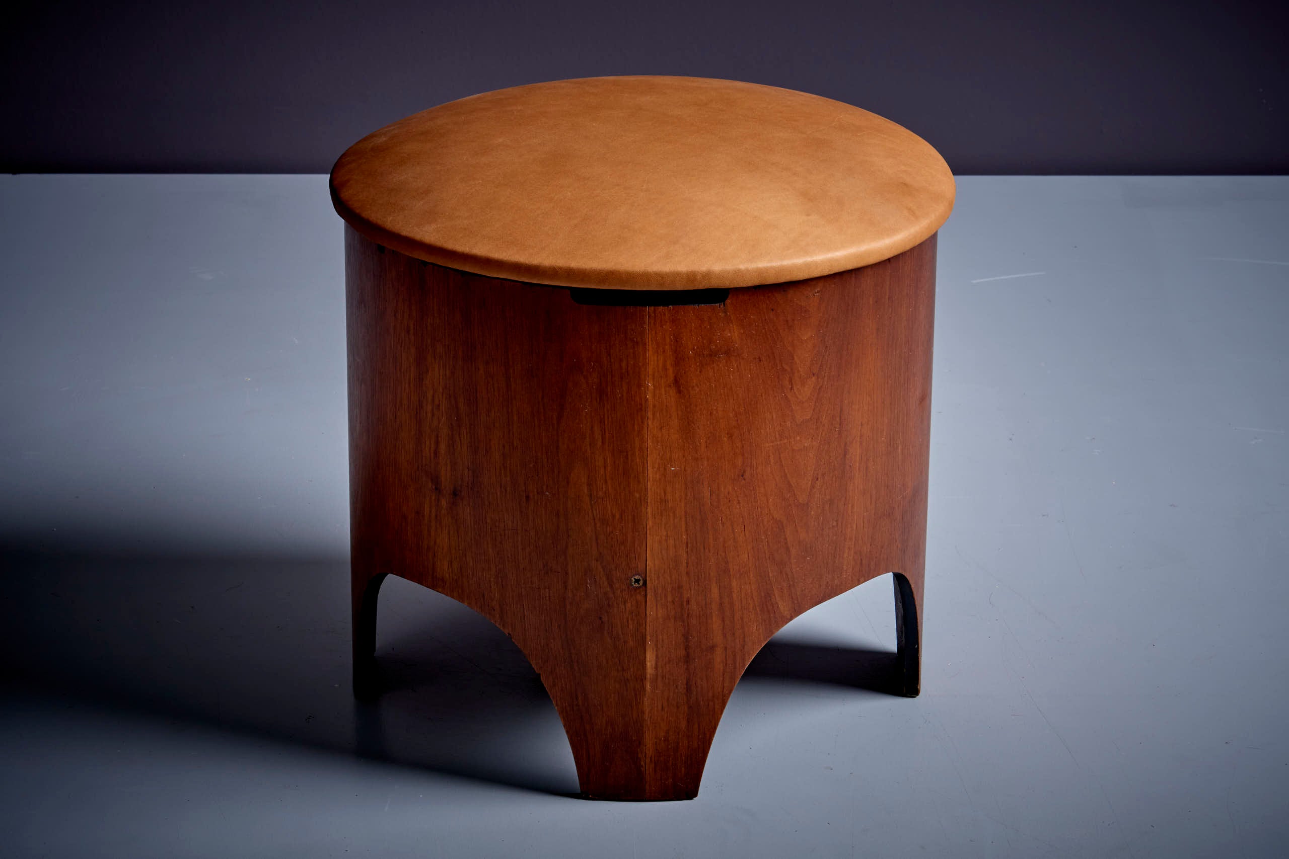 Henry P glass stool with hidden storage compartment. The stool has a new aniline leather upholstery. The stool can also be used as storage space and features a removable top.
