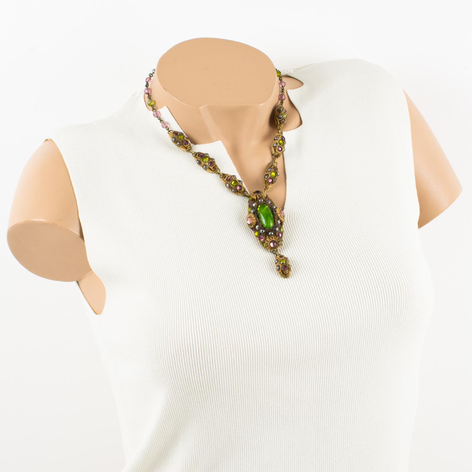 French jewelry artist Henry Perichon (aka Henry) designed this gorgeous Talosel resin necklace in the 1960s. The choker features brown-beige Talosel resin oval pendants topped with black pearl-like beads and purple and green poured glass cabochons.