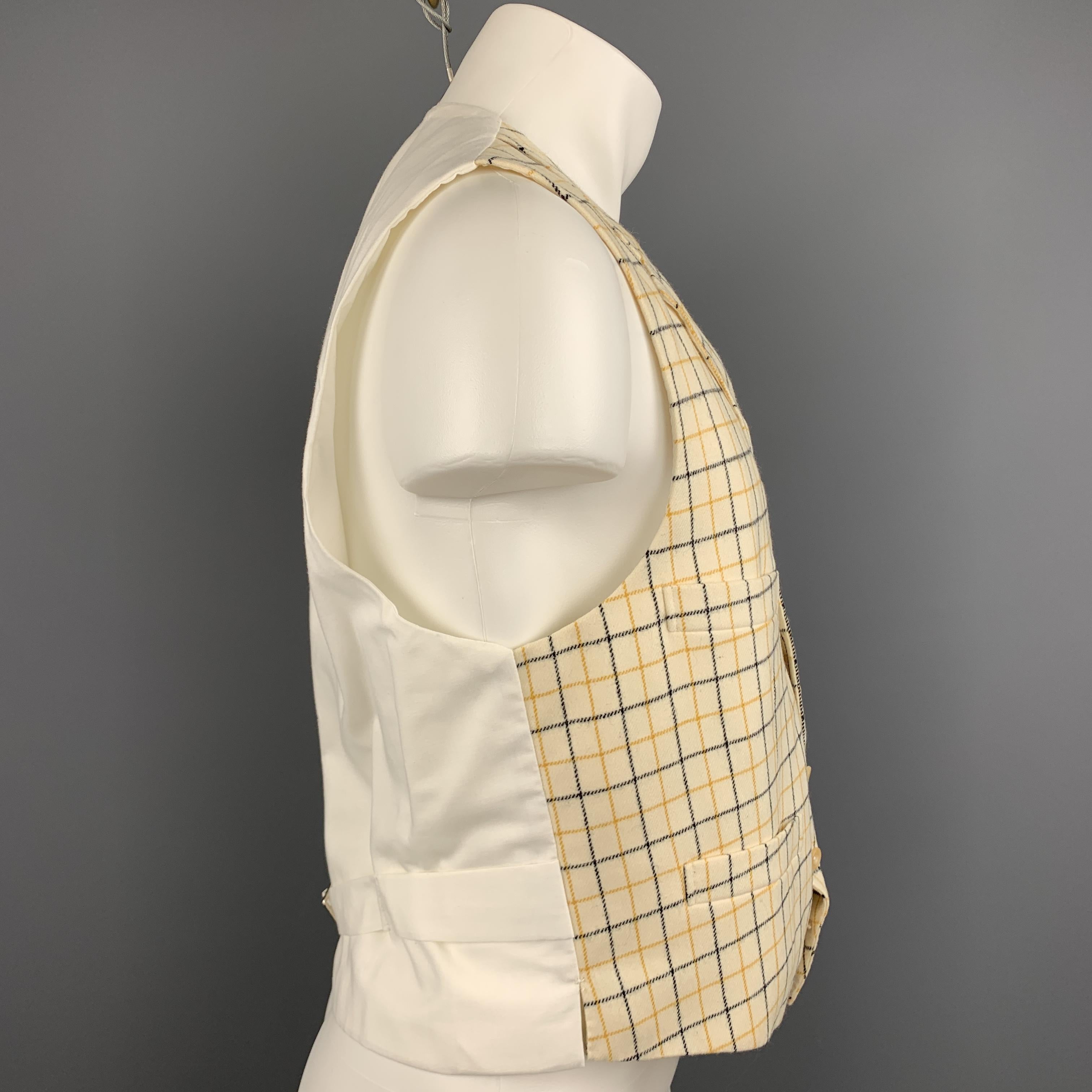 Custom Made HENRY POOLE & CO of Savile Row vest comes in a beige window pane wool featuring a notch lapel style, slit pockets, back belt, and a buttoned closure. Made in England.

Excellent Pre-Owned Condition.
Marked: (No