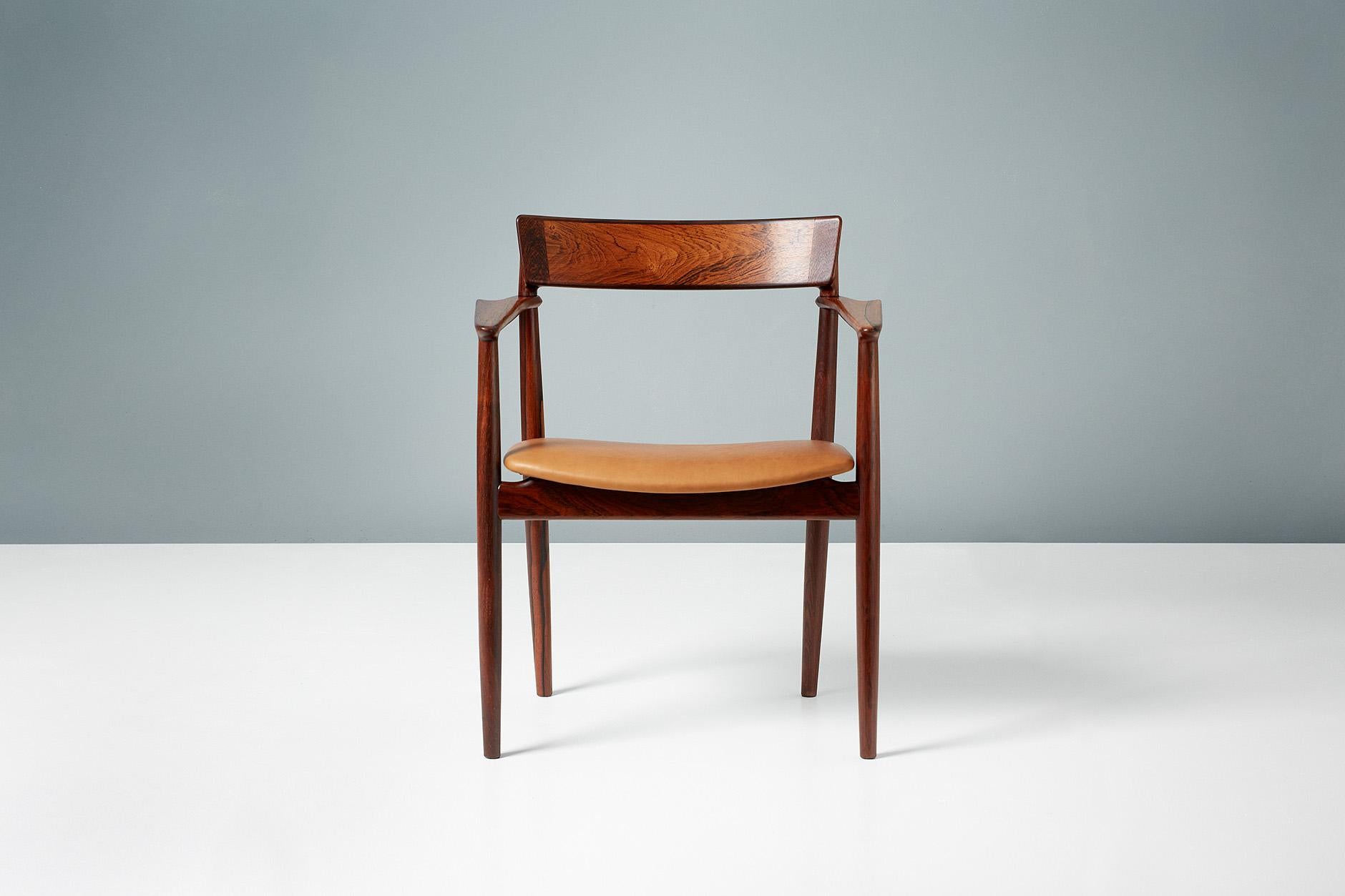 Henry Rosengren Hansen

Armchair, 1960

Angular, sculpted armchair from Henry Rosengren Hansen produced by Brande Mobelfabrik in Denmark using exceptional quality Brazilian rosewood. The seat has been reupholstered in tan aniline leather. 
 