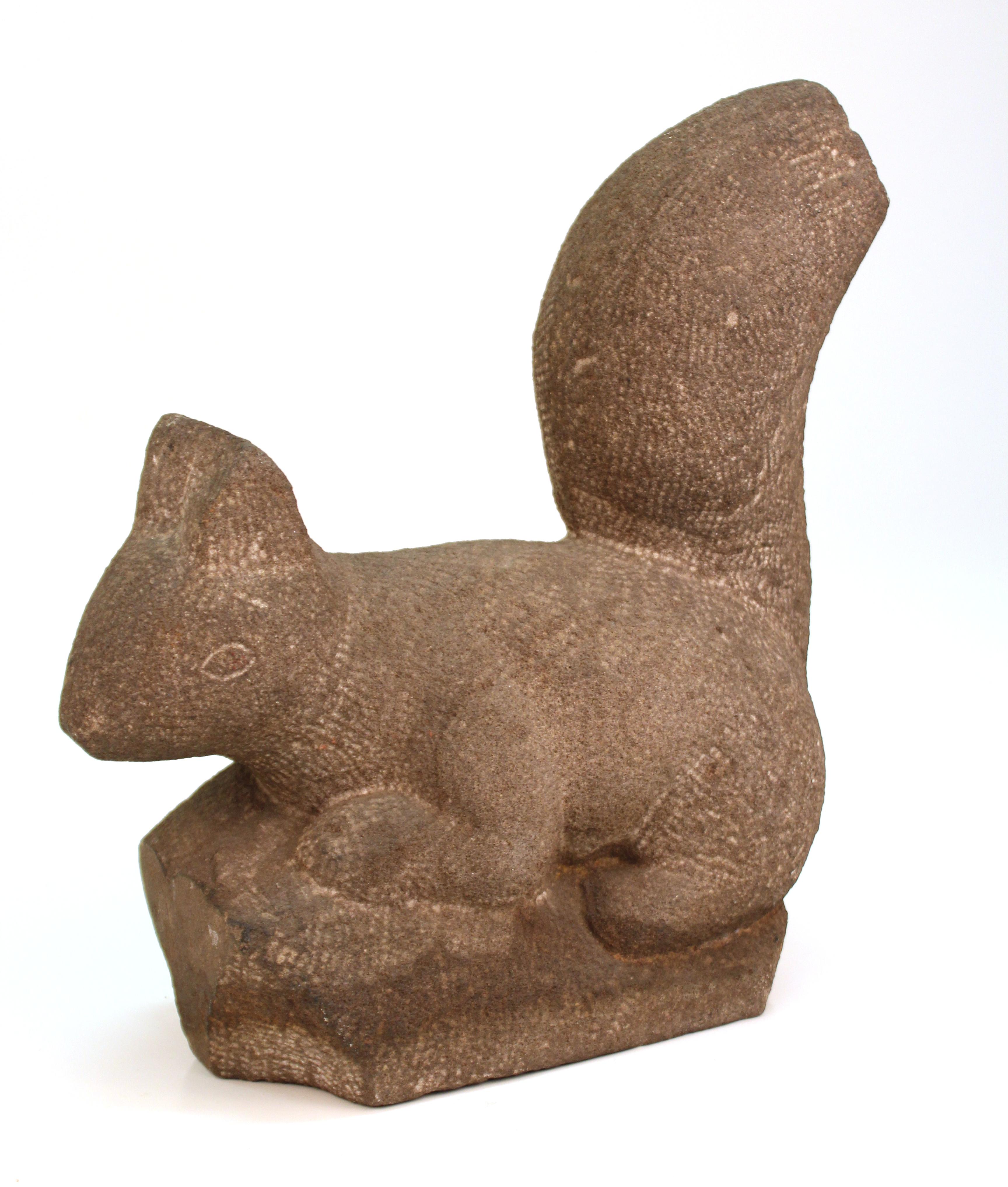 Squirrel sculpture by Hungarian-American artist and sculptor Henry Schoenbauer (1895 Hungary - 1973), carved in stone. The piece was created during the mid-20th century. The artists' signature is carved on the bottom of piece. In great vintage