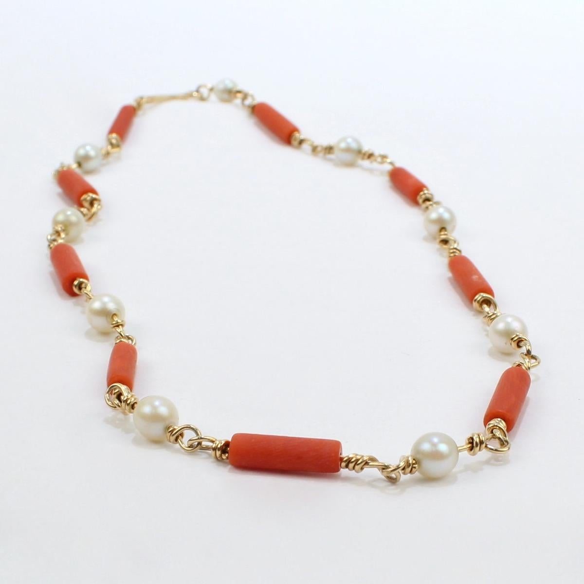 A very fine Henry Steig coral & pearl choker necklace.

In 14k yellow gold with alternating links of gold wire and round white pearls or salmon red coral beads. 

A simple and beautiful design from an important American Modernist!

Date:
20th