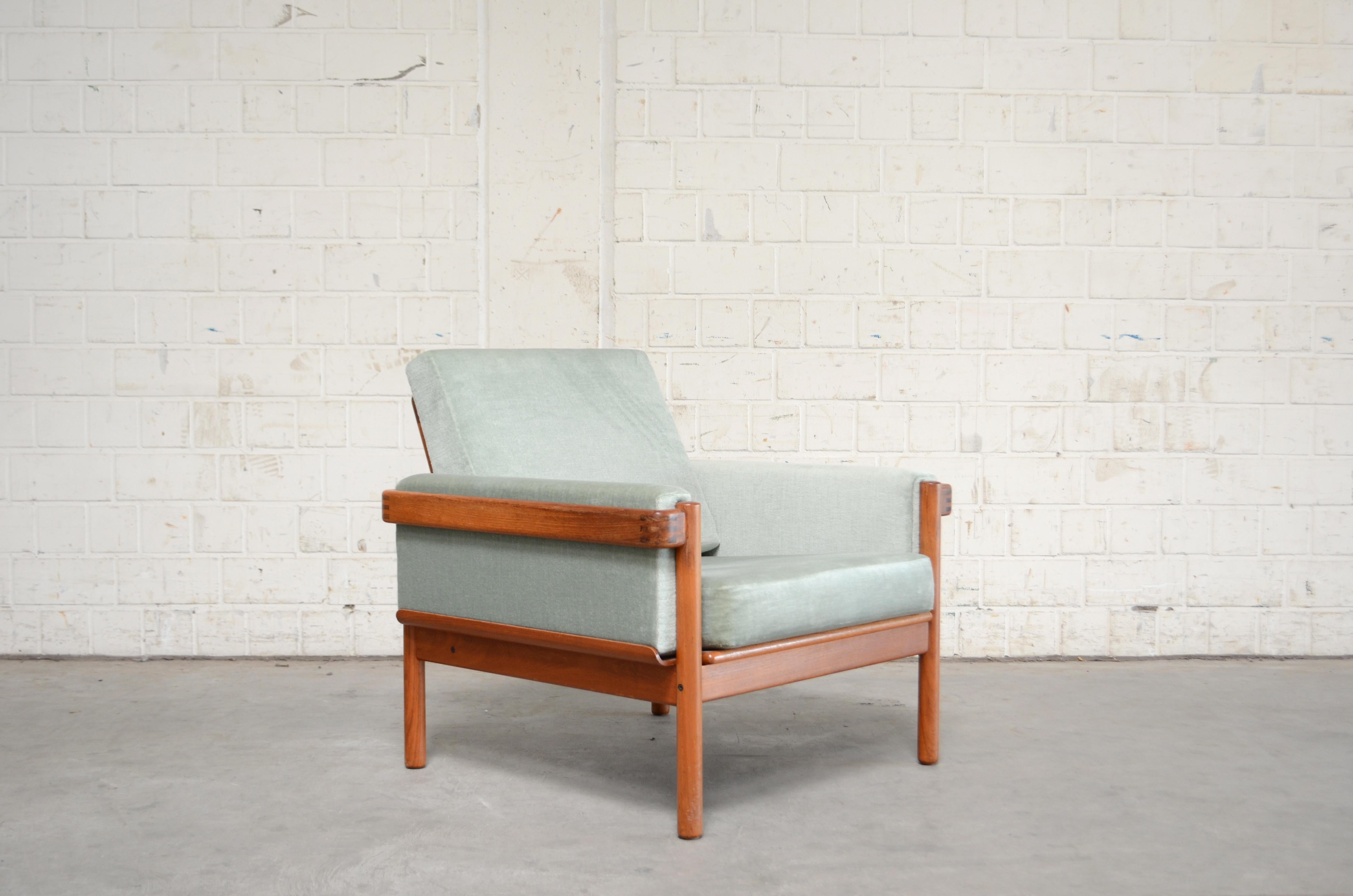 Danish modern armchair by Henry Walter Klein for Bramin.
The frame is made of solid teak wood with some nice details.
The cushions are renewed some years ago in velour fabric pastel color.
We have 3 of this armchairs in stock and also the sofa.
 