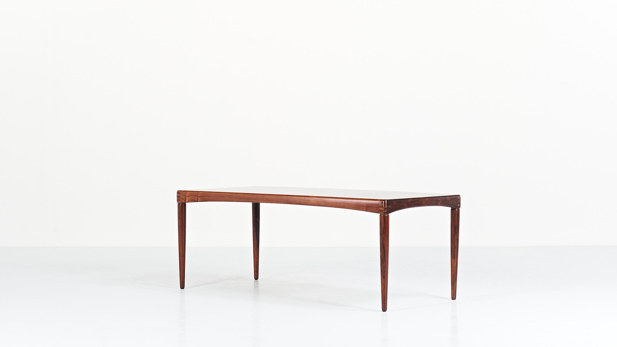 Rare coffee table in rosewood veneer and solid rosewood, by the Norwegian designer Henry Walter Klein for Bramin. Superb finishes. Labeled and dated July 5, 1968. Very slight traces of use, very good condition.