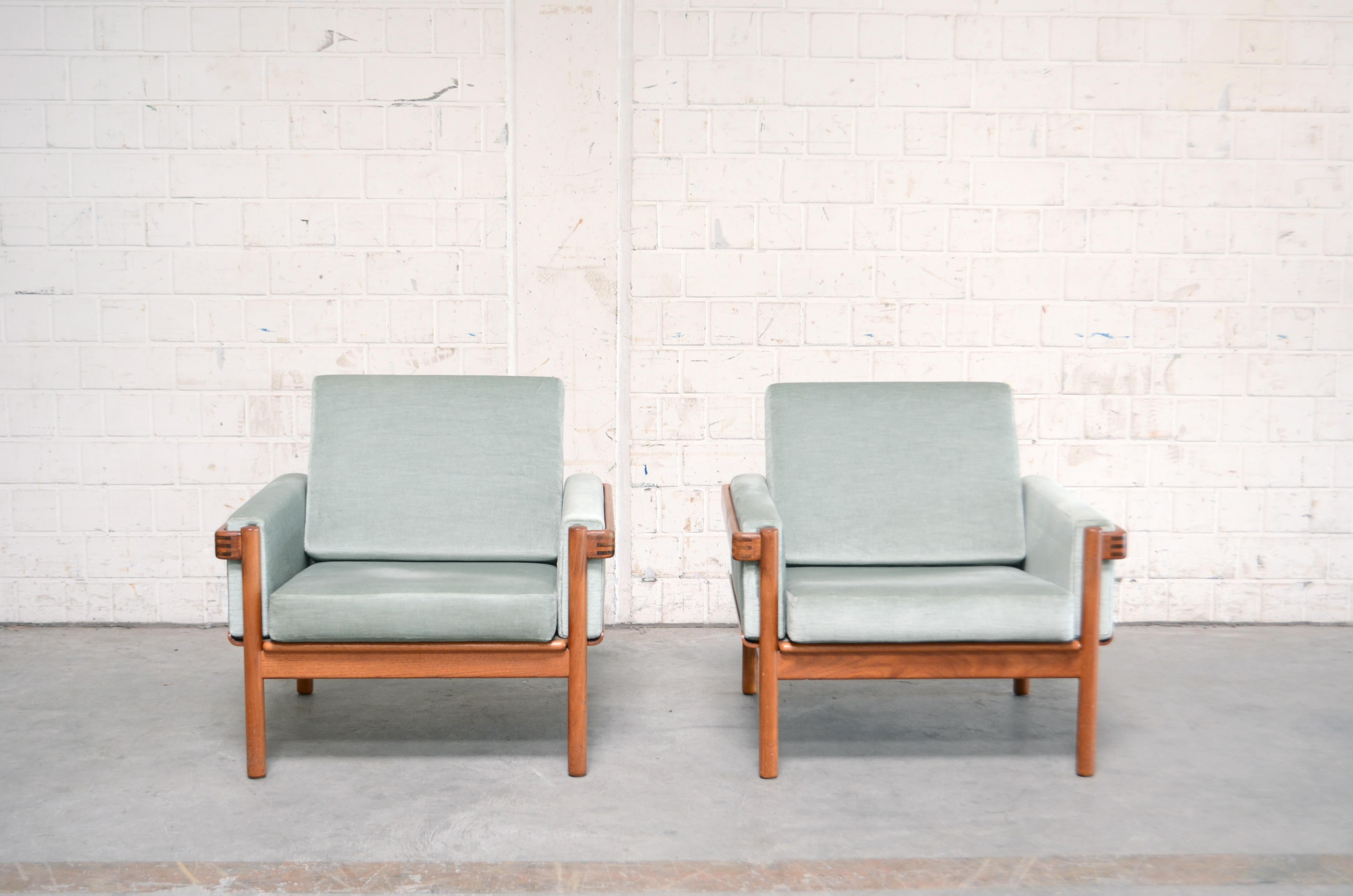 Danish modern armchair by Henry Walter Klein for Bramin.
The frame is made of solid teak wood with some nice details.
The cushions are renewed some years ago in velour fabric pastel color.
Set of 2.
 