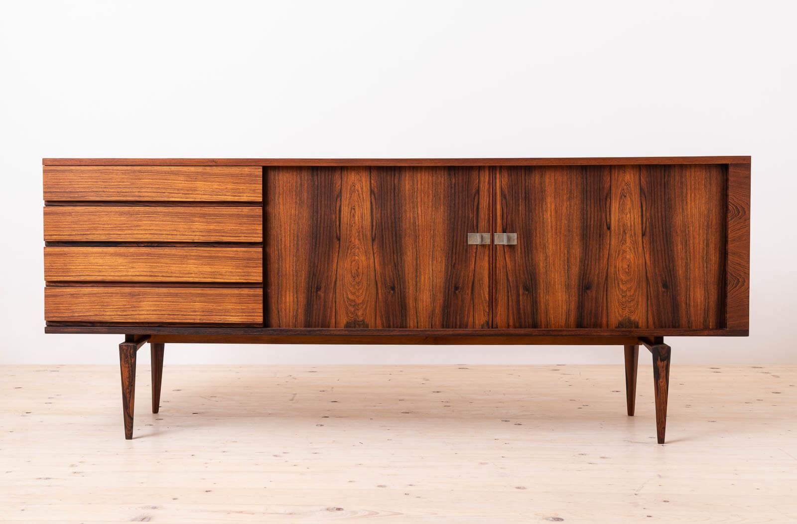 This gorgeous Mid Century Modern Sideboard was designed by Henry Walther Klein, dating from the 1960s. Crafted by Bramin Møbler in Denmark, this elegant credenza exemplifies superb craftsmanship and balanced proportions characteristic of Klein’s