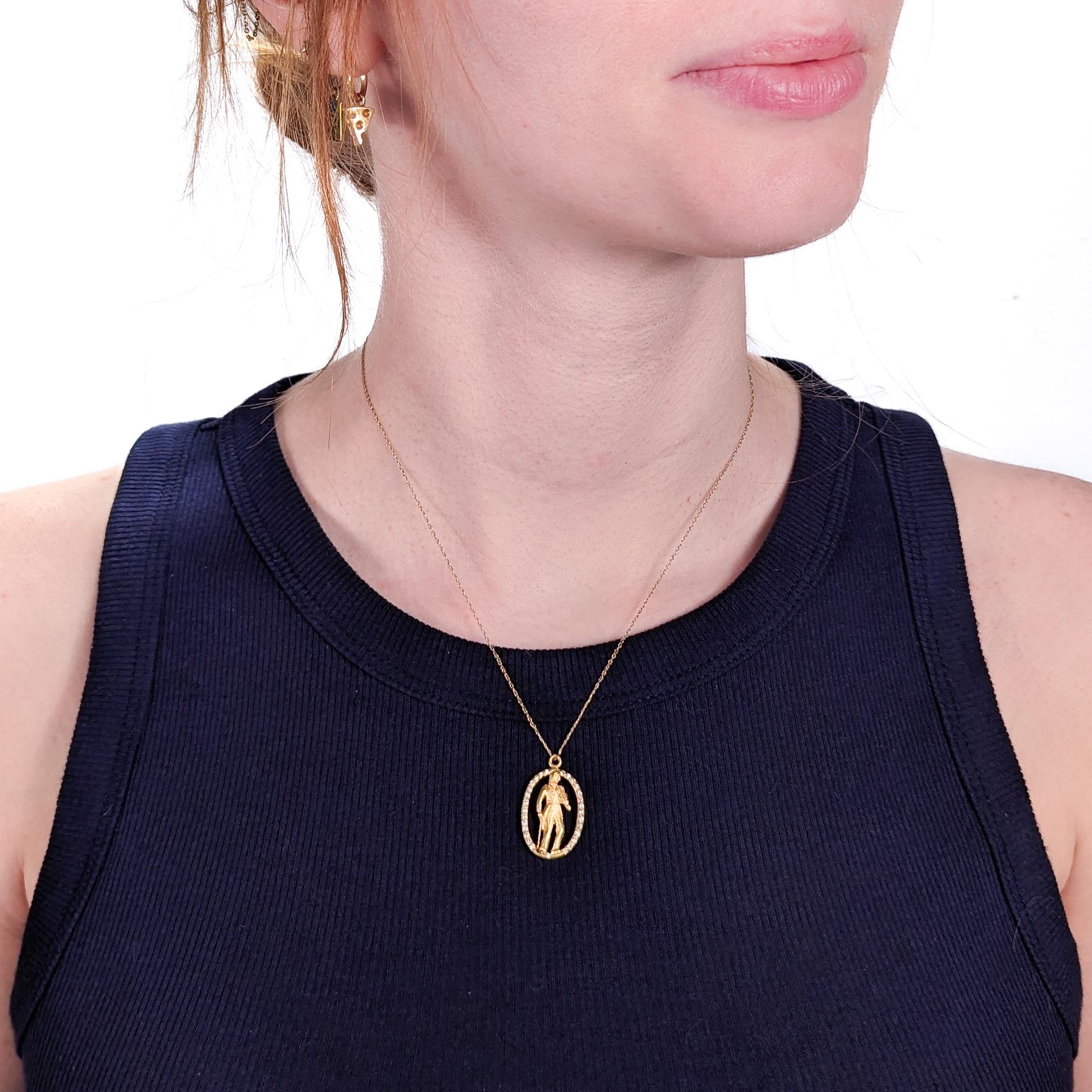 A very fine gold & diamond oval pendant by Henryk Kaston.

By repute, the pendant is meant to be a depiction of the Violin Virtuoso, Nicolo Paganini. 

It features a full-figured cameo of Paginini (with bow and violin in hand) framed in pave-set