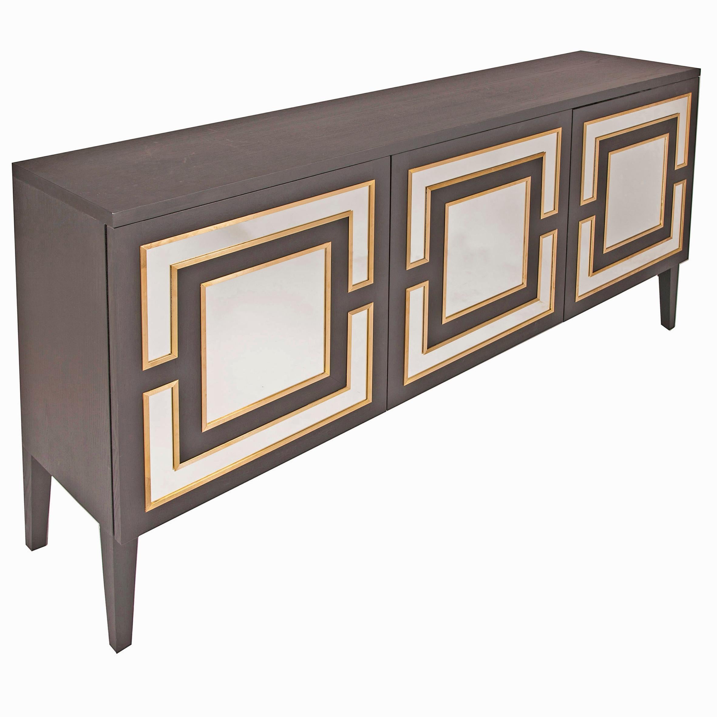 Chocolate stained wood sideboard with push-to-open doors, brass trim and mirror detail. Also available in black (RAL 9004) or white (RAL 9001) satin lacquered colour finish on request.

180W x 40D x 90H cm

1 x ex-display