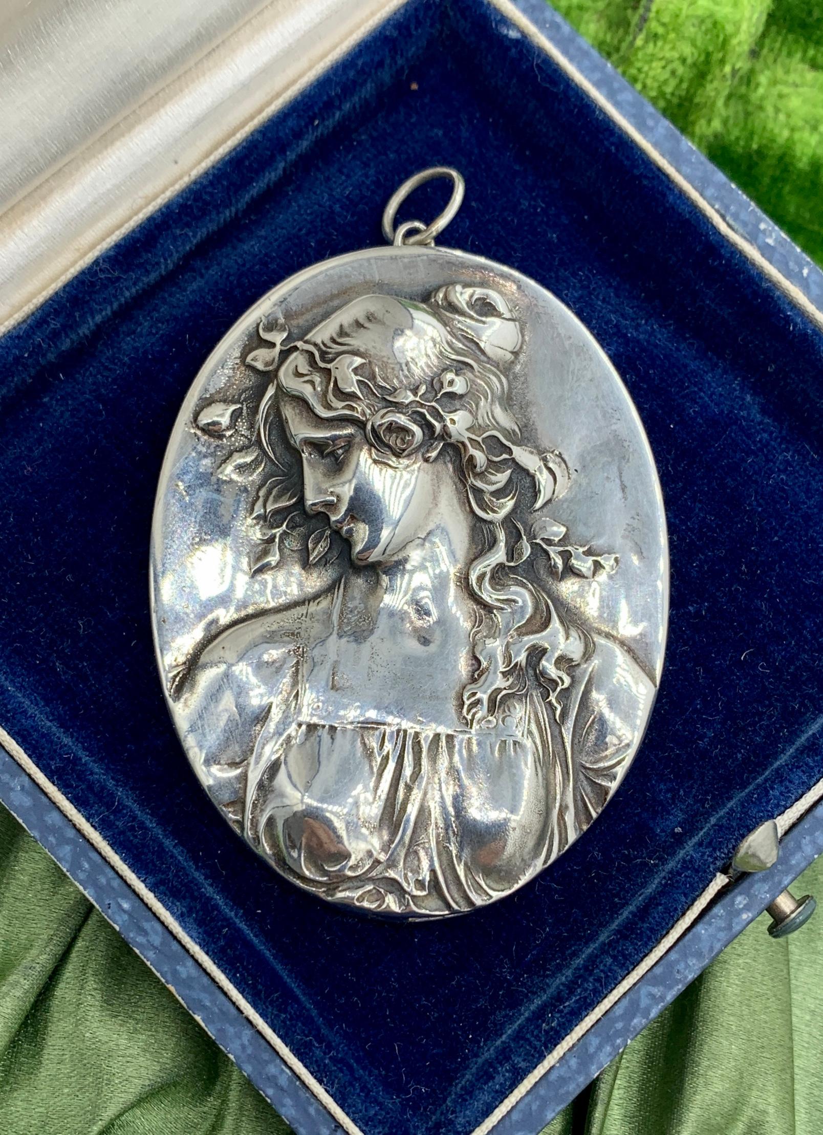 Indulge in a Primavera Henryk Winograd Sterling Silver Pendant Necklace.  This is a stunning Sterling Silver Pendant by Henryk Winograd featuring a gorgeous deep repousse image of a woman with flower garlands in her hair depicting the Primavera or