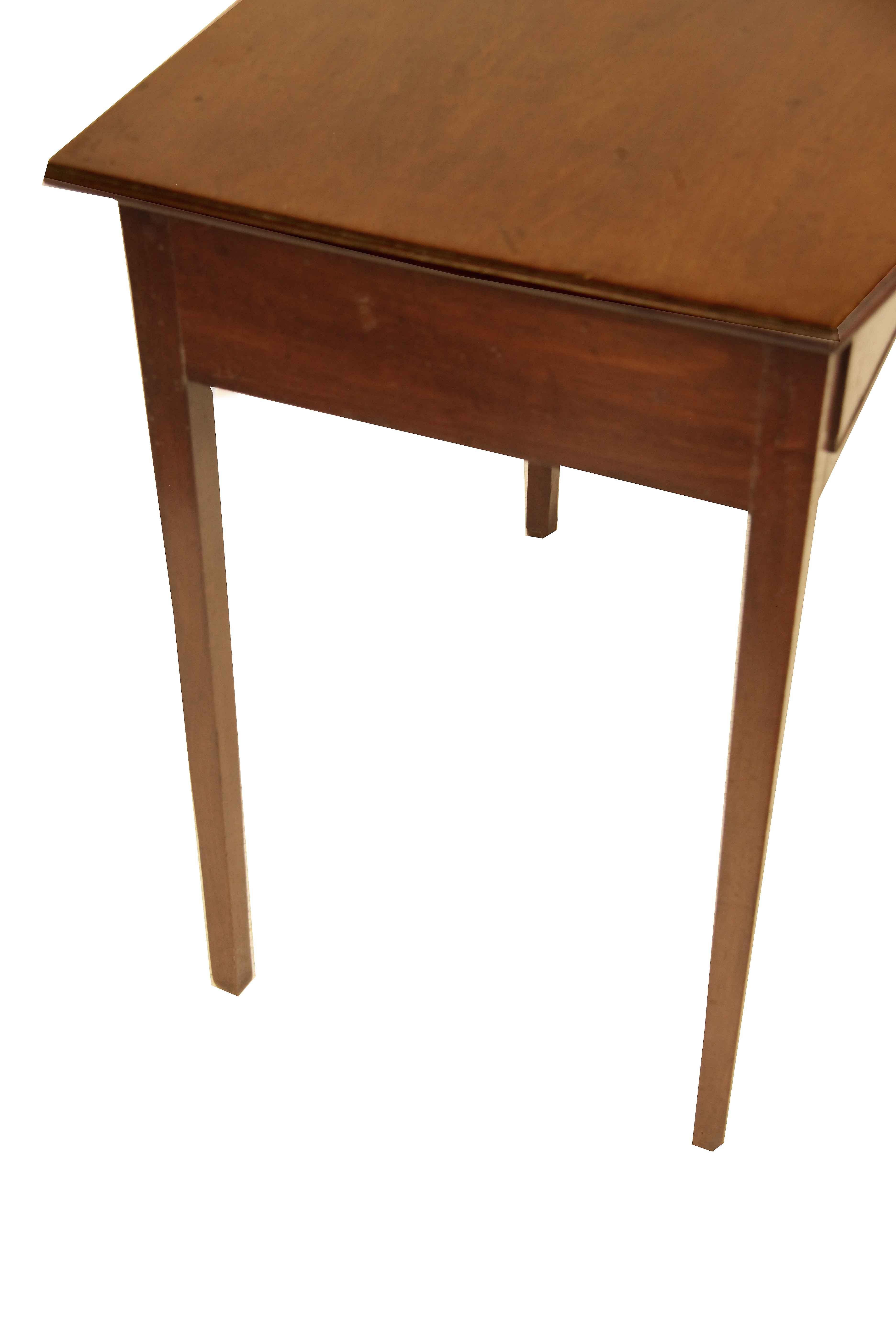 Hepplewhite bow front side table, this early 19th century table has a beautiful faded mahogany color and patina, especially the bow front top; the single drawer retains the original brass knob; pine is the secondary wood. The legs are nicely tapered.