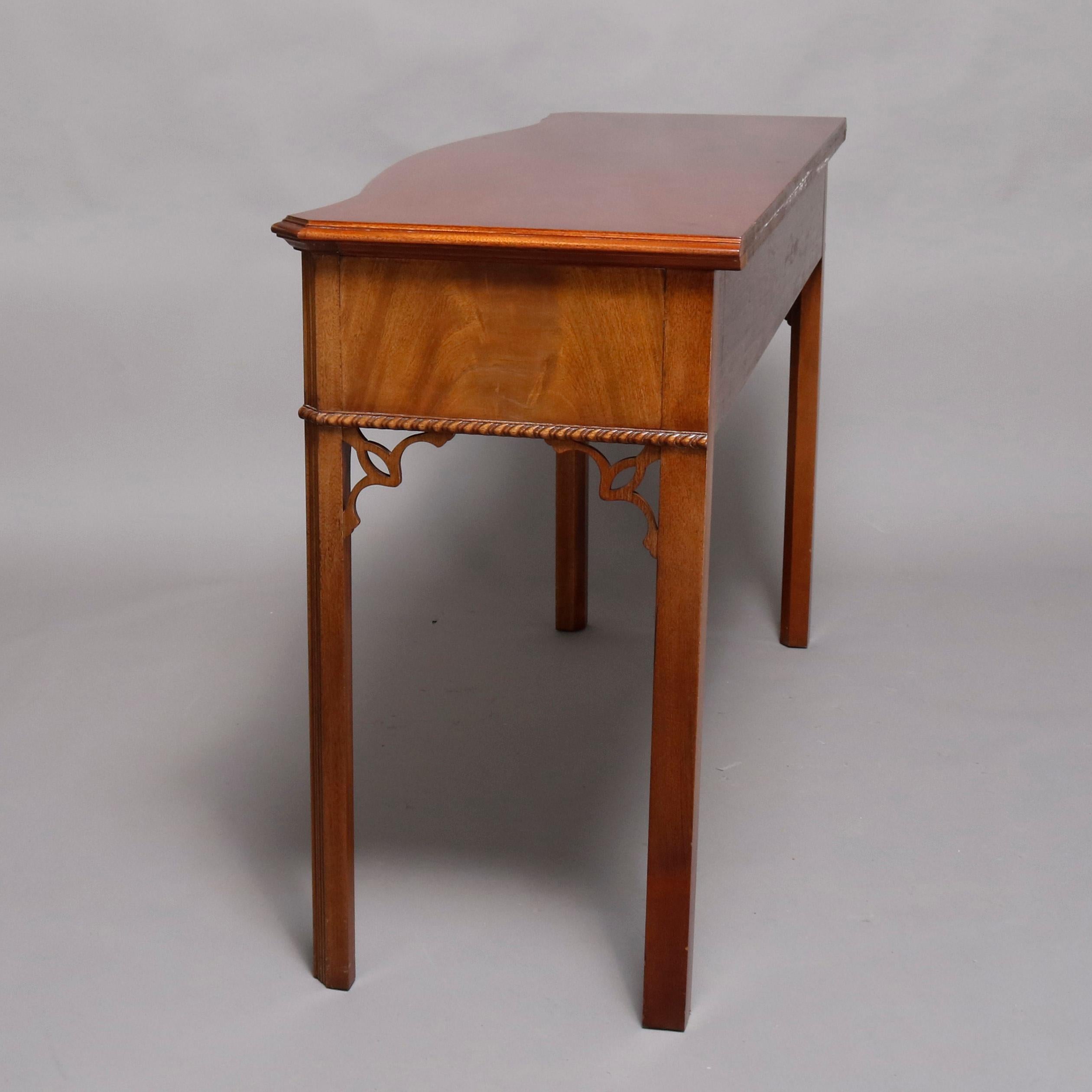 A Hepplewhite style server custom handcrafted by Councill Craftsmen offers serpentine form and flame mahogany construction with cabinet having two drawers, rope twist trimming and raised on square and tapered legs having cutout corbels, 20th