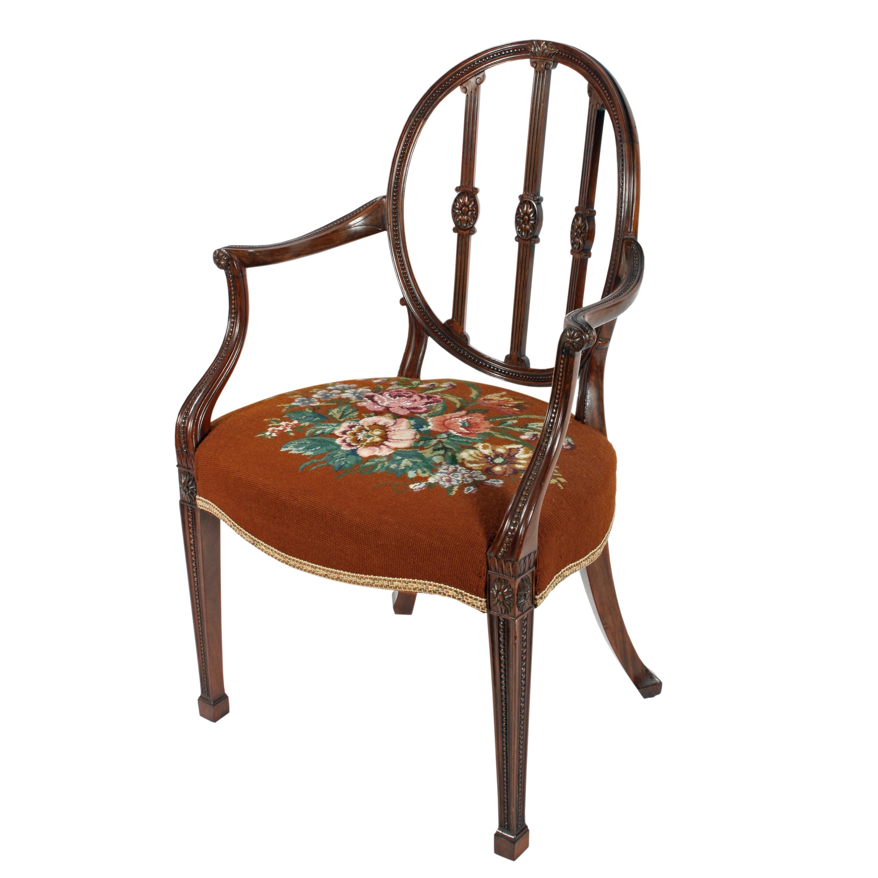 Hepplewhite design mahogany elbow chair

 

A Fine example of an Edwardian mahogany Hepplewhite design arm or elbow chair.

The chair has an oval back that is inset with 'Pea' carving, three upright spats that are fluted and have oval carved