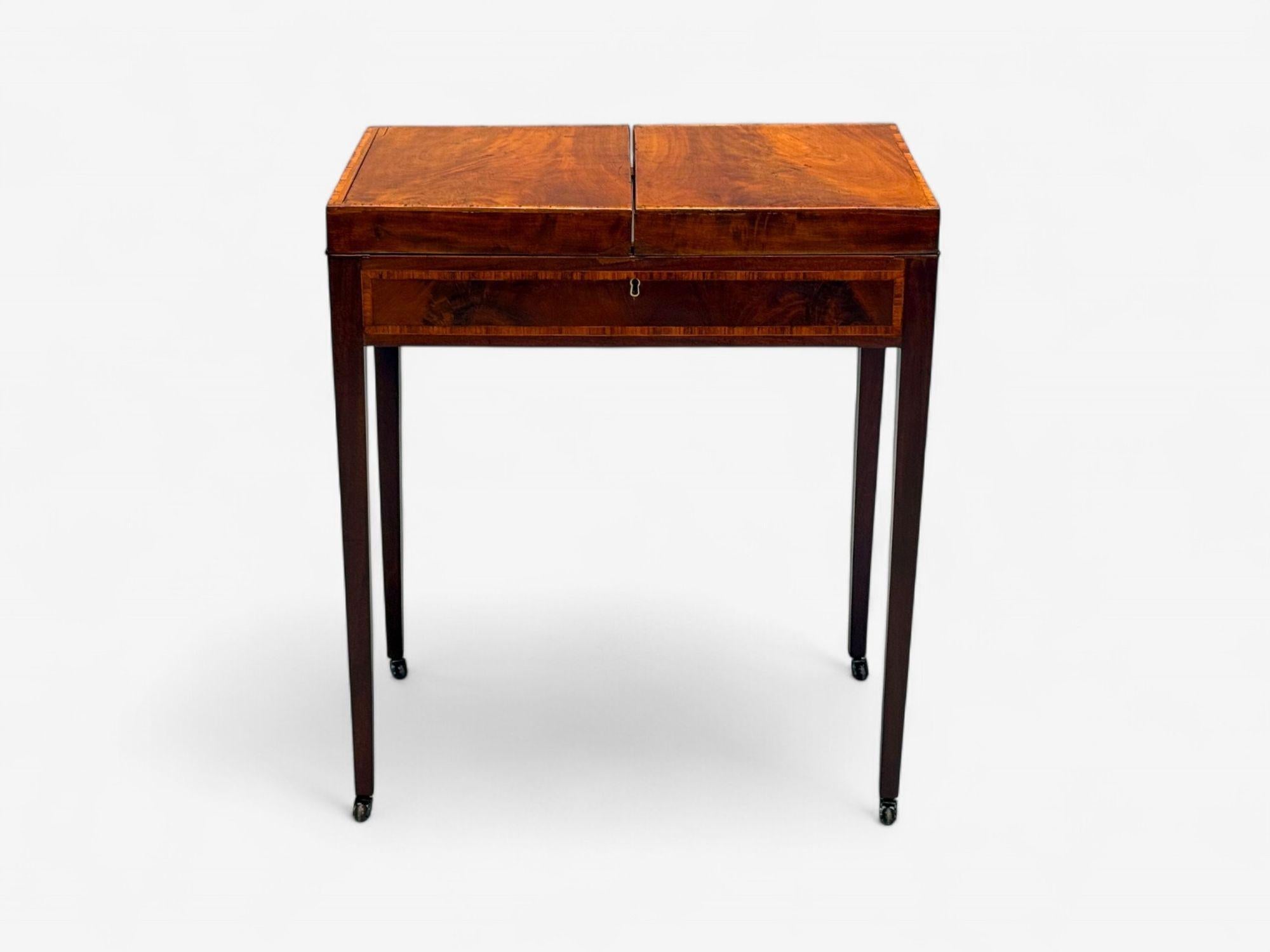 George III, Mahogany, Hepplewhite Dressing Table, England, 19th C., Refinished

A fine example of a professionally refinished Antique Hepplewhite style dressing table. Butterfly top has inset-hinges with book-matched panels and crossbanding. Opens