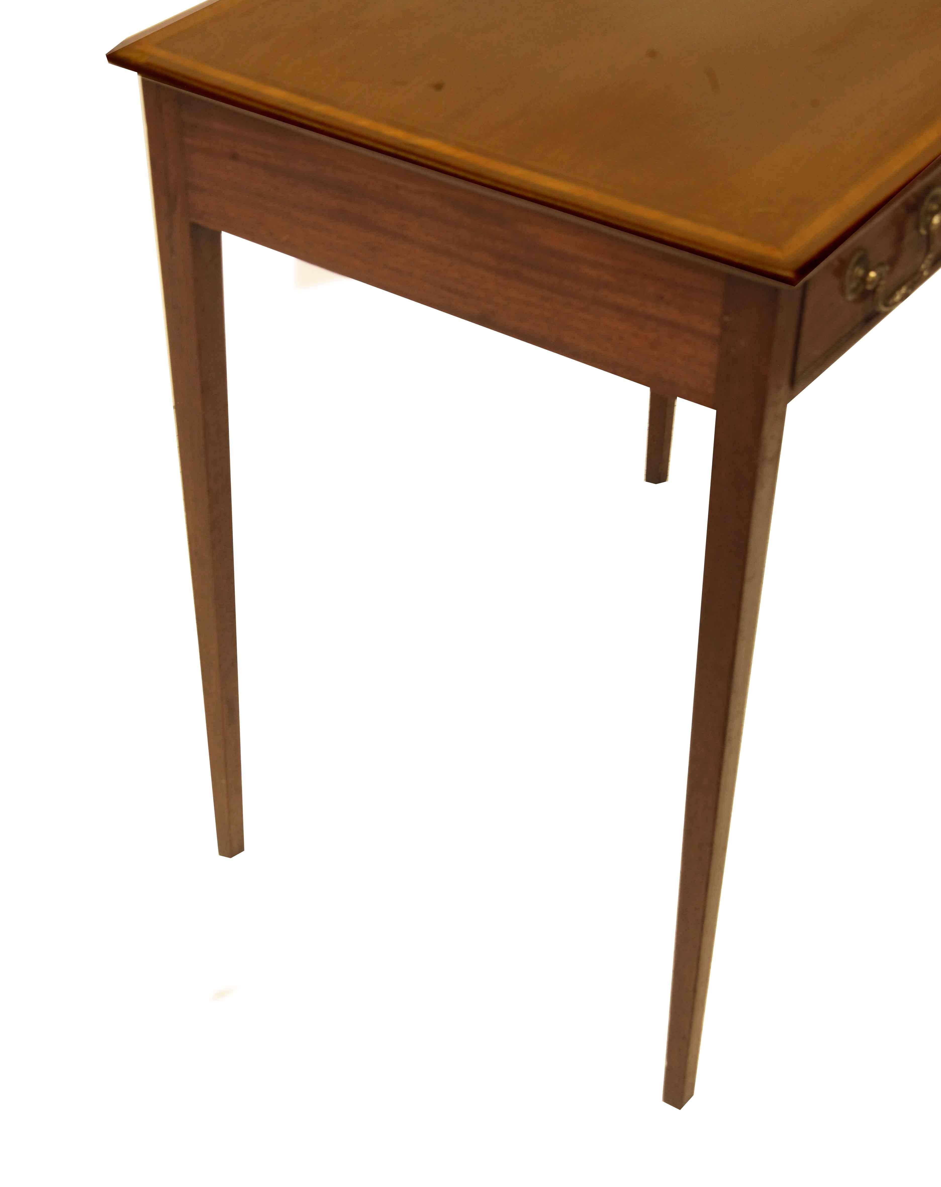 Hepplewhite inlaid one drawer table, the top features an inlaid conch shell in the center, the perimeter of the top is inlaid with a boxwood string and also a band comprised of boxwood and king wood. The single drawer has decorative swan neck pulls
