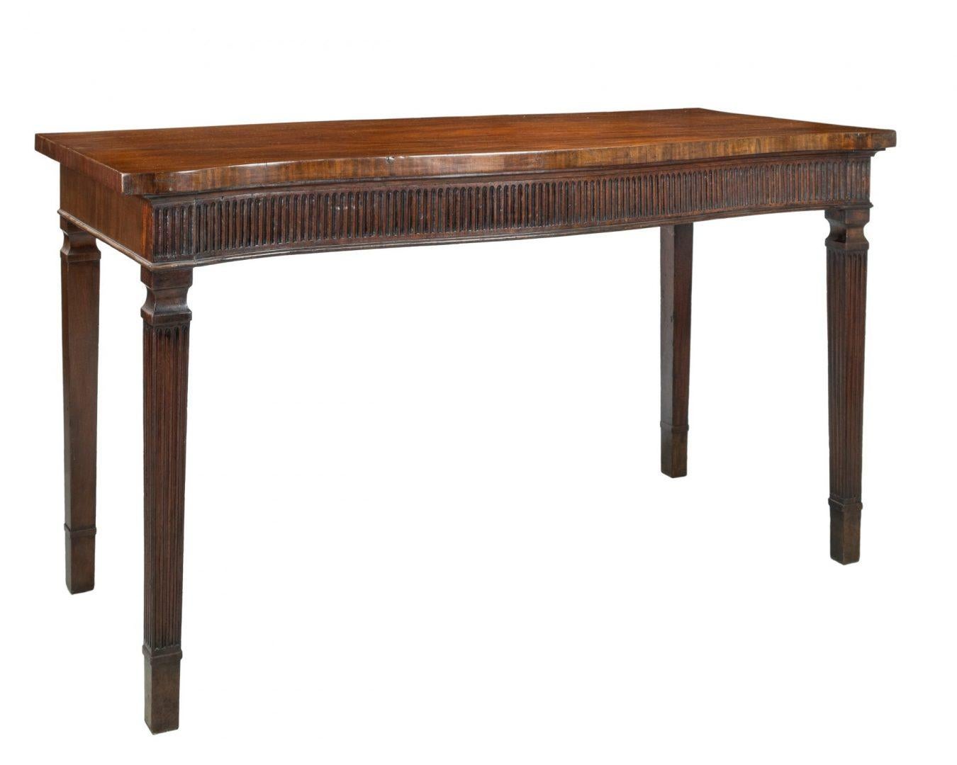 A fine mahogany serpentine fronted hall or serviving table, with fluted freeze and square tapered legs, late 18th Century.




Dimentions 168cm Long x 71cm Deep x 93cm High



George Hepplewhite (1727 – 21 June 1786) was a cabinetmaker. He