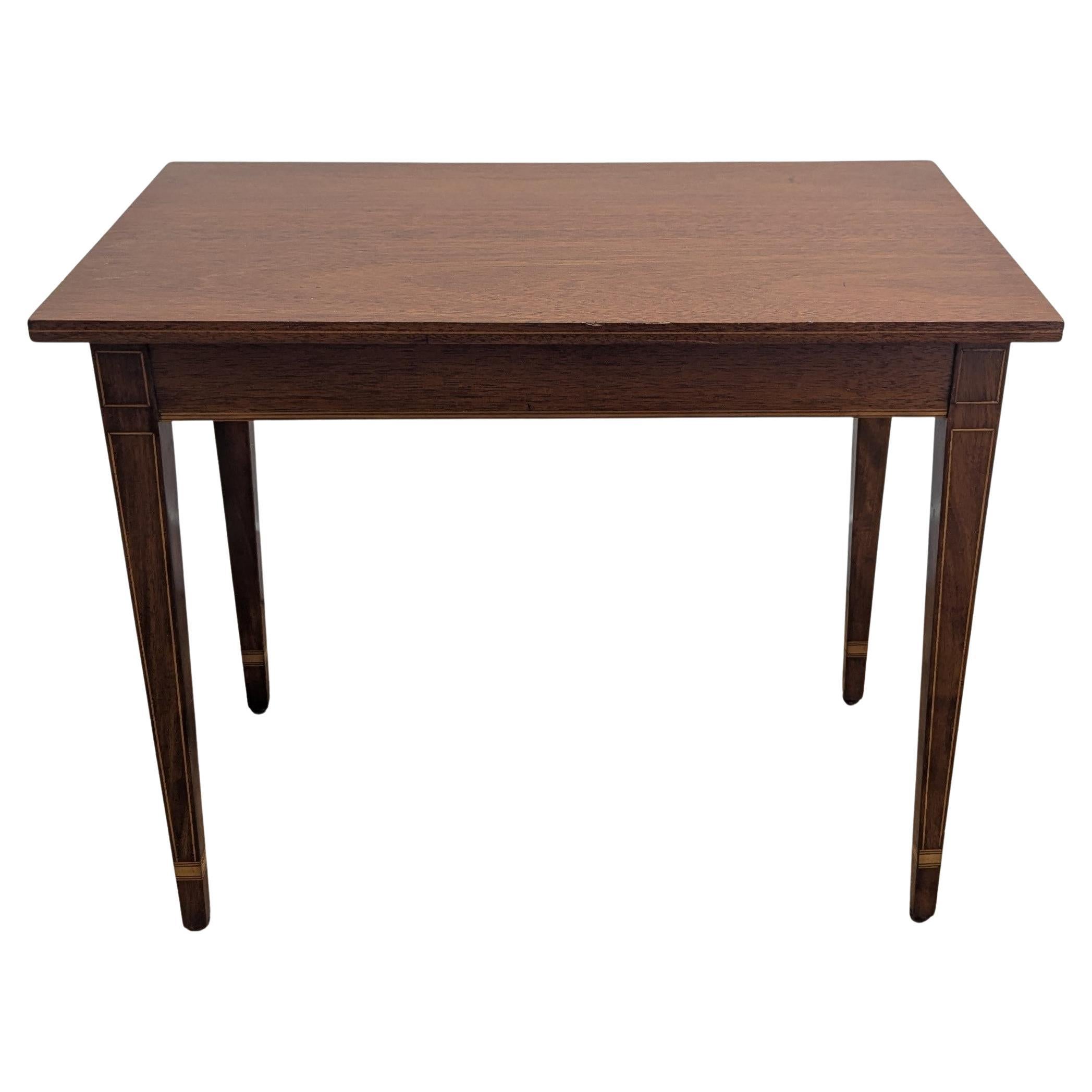 Elegant Hepplewhite style side table.  Solid mahogany with satinwood inlay,  
 early middle 20th century dated in pencil to underside 2-1-41.  Beautiful fine lines with a refined inlay detail.  Take note of the inlaid satinwood center line to the