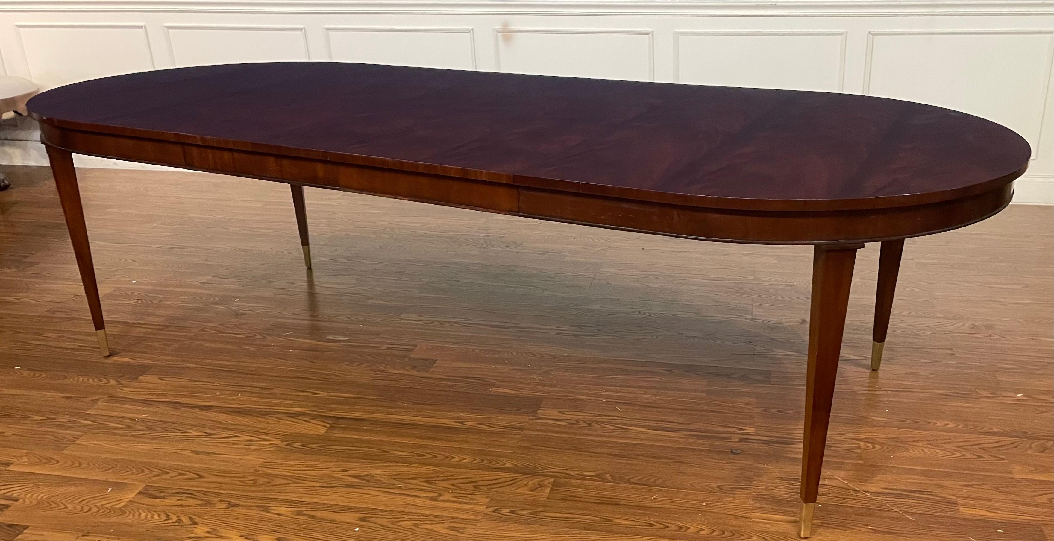 This is a traditional oval mahogany dining table made in the Leighton Hall shop in Suwanee, Georgia.  It features a top with figured swirly crotch mahogany from west Africa.  The top has Leighton Hall’s premiere hand rubbed and polished semi-gloss