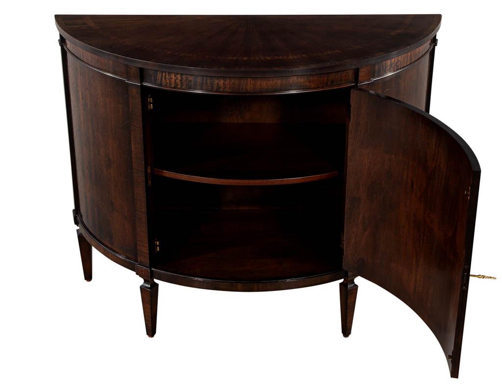Hepplewhite Zebrano Demi Lune Commode Chest. Beautiful detailed zebrano wood grains with unique circular pattern on fronts. Commode features dark stain finish with single shelf storage compartment. Only 1 Available.

Price includes complimentary
