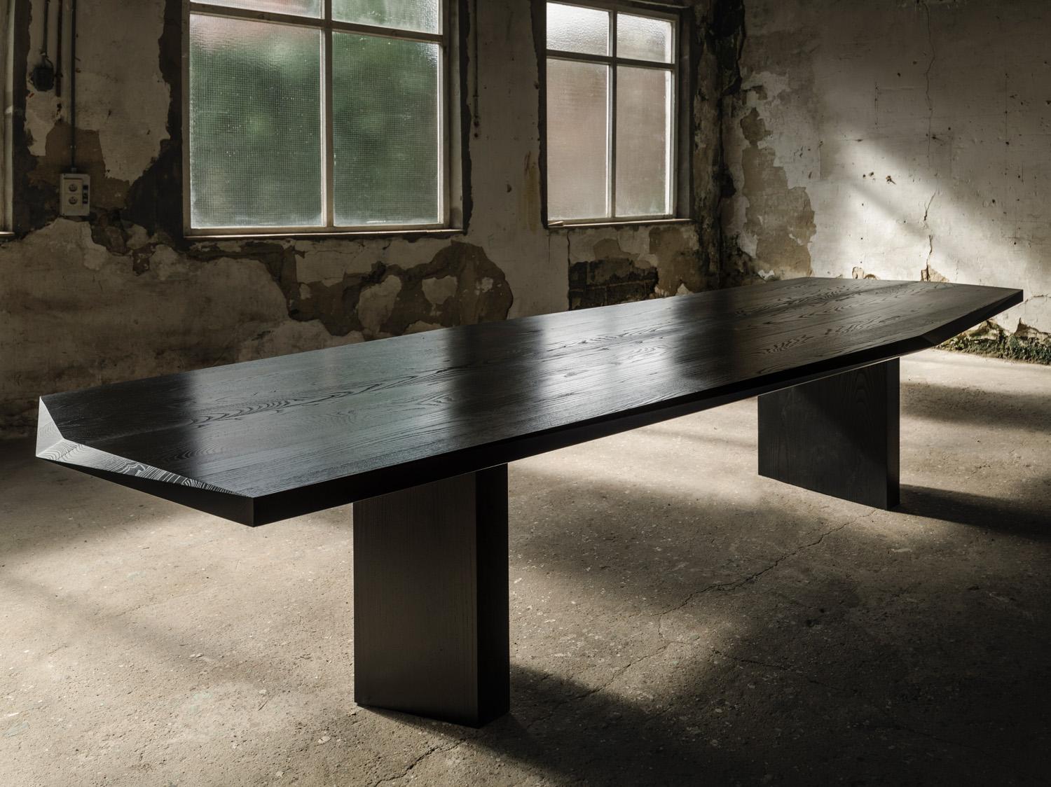 Hera 360 table by Tim Vranken
Materials: Black American Ash
Dimensions: L 360 x W 129 x H 75 cm

Also available in American Ash and American Walnut. 

Hera, an interplay of lines and shapes, without the slightest frills. 

Tim Vranken is a