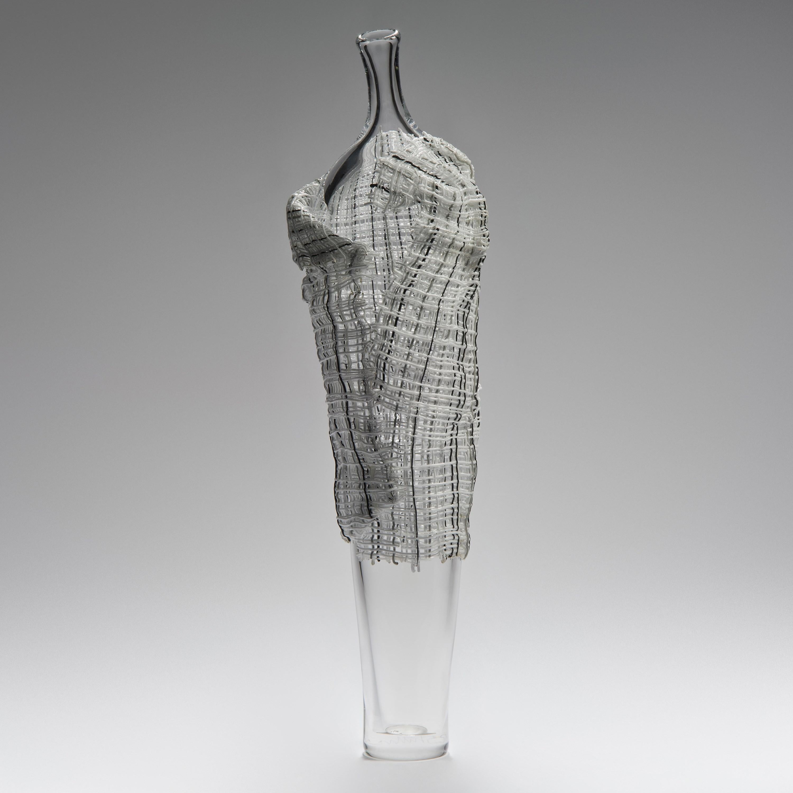 'Hera' is a unique glass sculpture by the British artist Cathryn Shilling. The interior figure is free-blown glass which is wrapped in kiln-formed glass cane 'fabric' which is applied hot. With her Cloaked Collection, Shilling takes mythical tragic