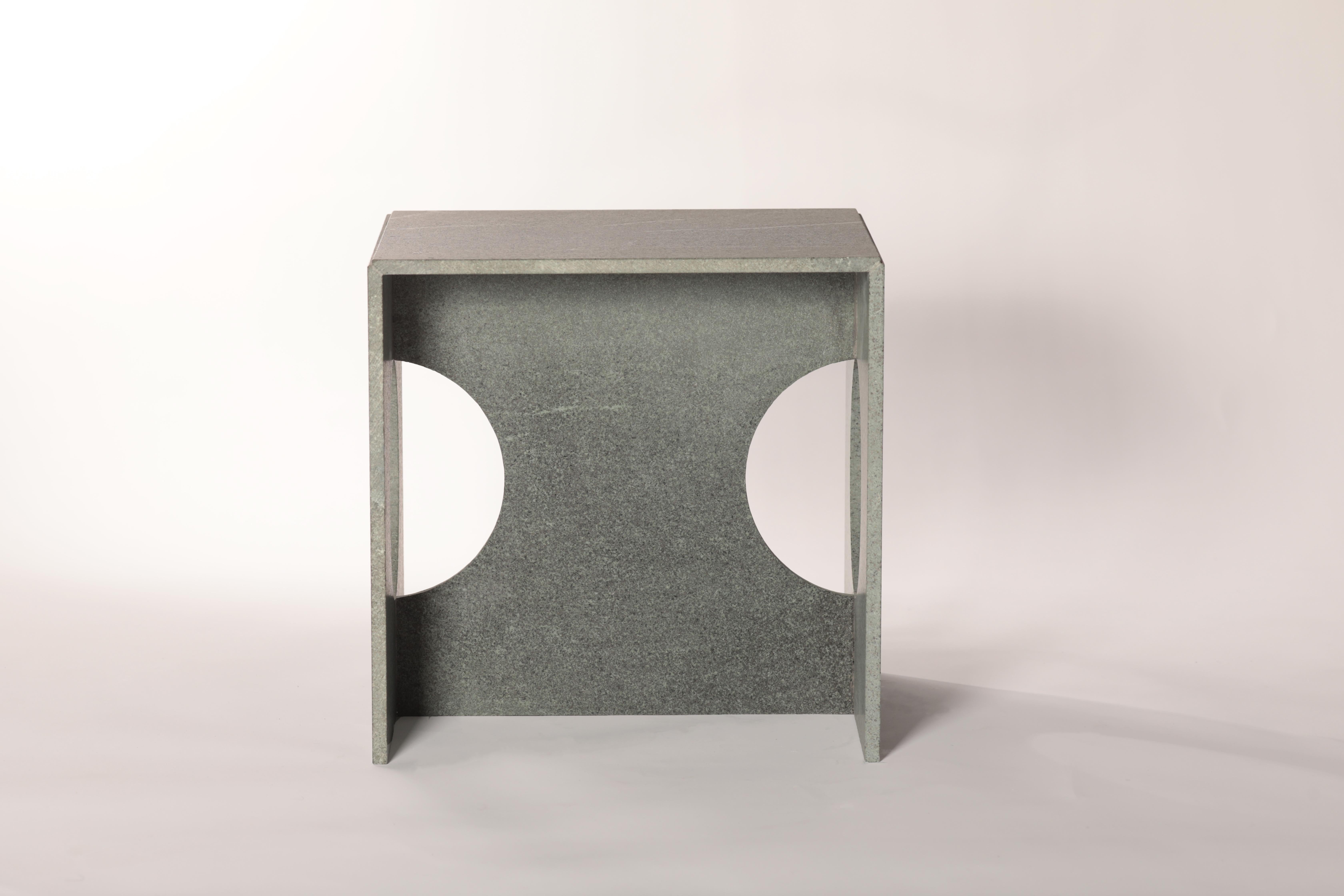 The perfect shape cube becomes more characterized by the voids inside. While lightening the marble, the circle voids also provides ease of use and make it more comfortable to carry it around. It will change the dynamics of the space with its unique