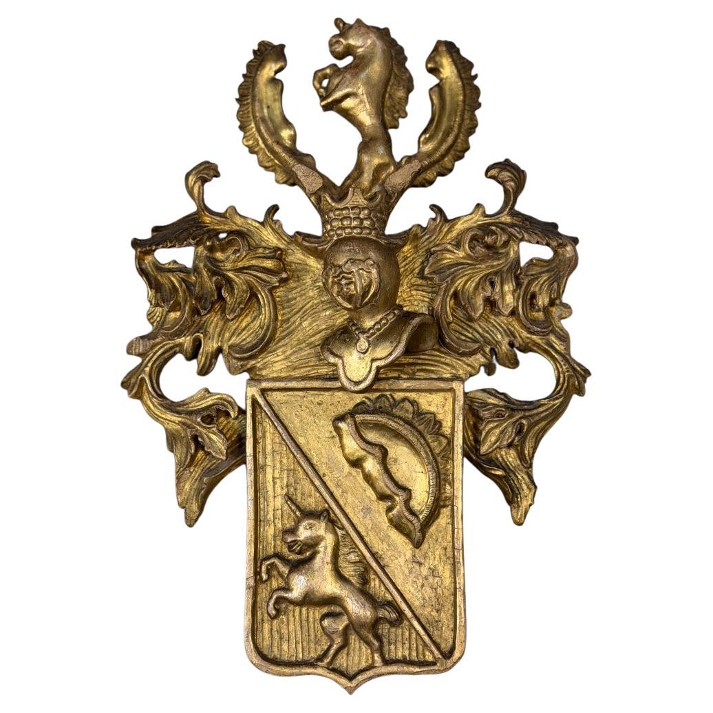 Heraldic cartouche in carved and gilded wood, Belgium, 19th century