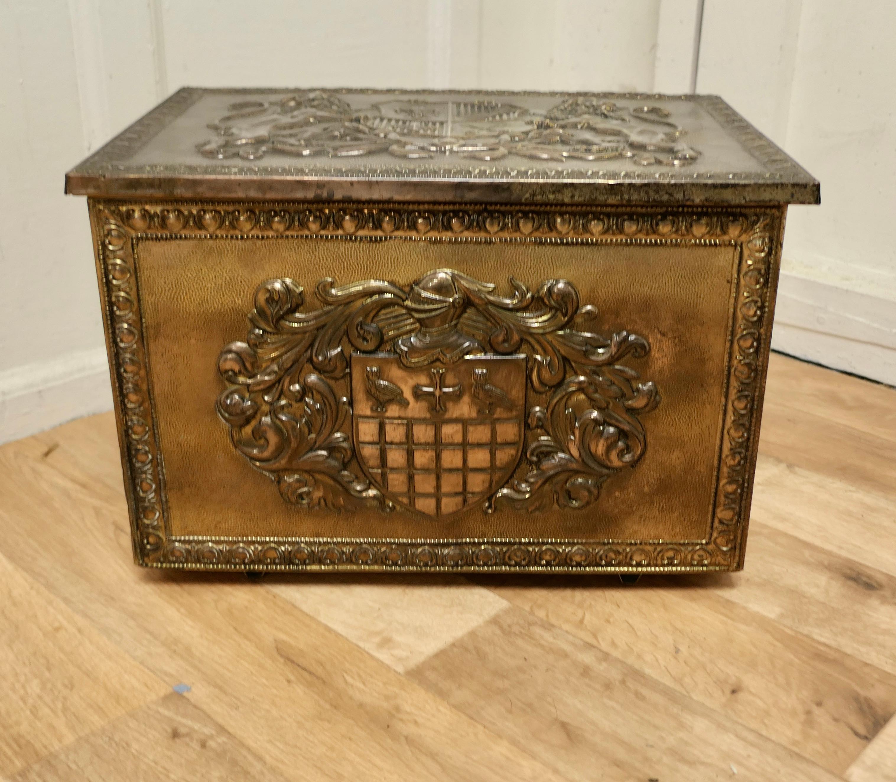 Heraldic embossed brass log box, with coats of arms.

This is a strong chest is made in Brass, the beaten brass is embossed with coats of Arms with Fleur des Lys and Crossed Keys.
This is an old piece it has a very good dark colour, it is in good