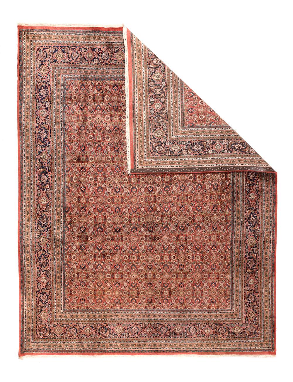 Herati Rug 9'2'' x 12'0''.  This very well executed and evenly woven carpet shows a red field very closely covered with a small-scale, even Herati allover design accented in: navy, sand, cream and straw. Reversing turtle in the navy strip-style main