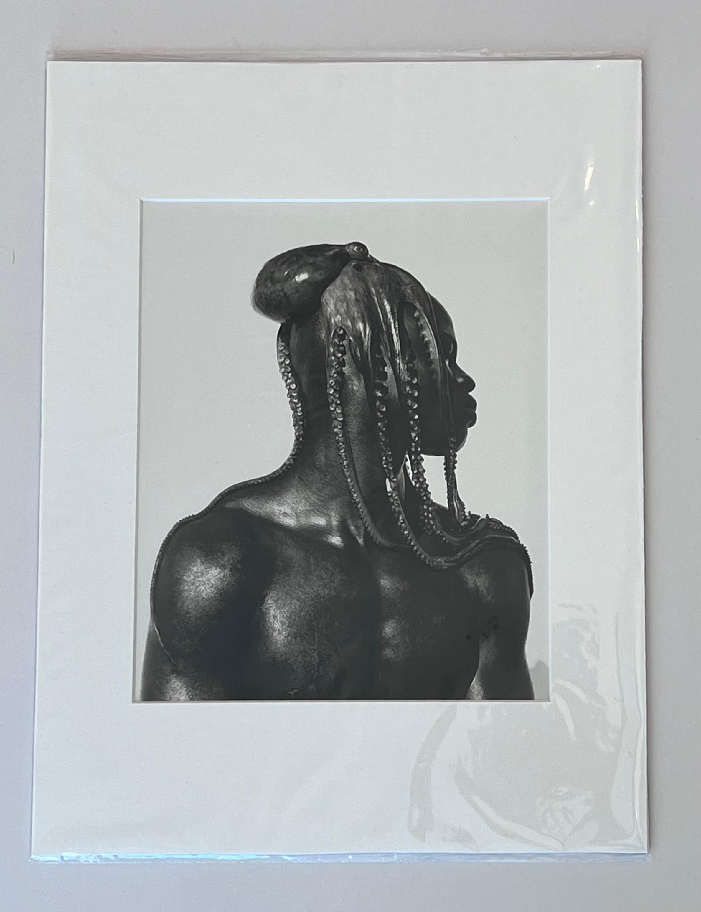 Dijmon with Octopus 1989
by Herb Ritts

A gorgeous black and white shot of actor and model Dijmon posing with an Octopus on his head. 

Unframed
Matted
Overall size : 12 x 16