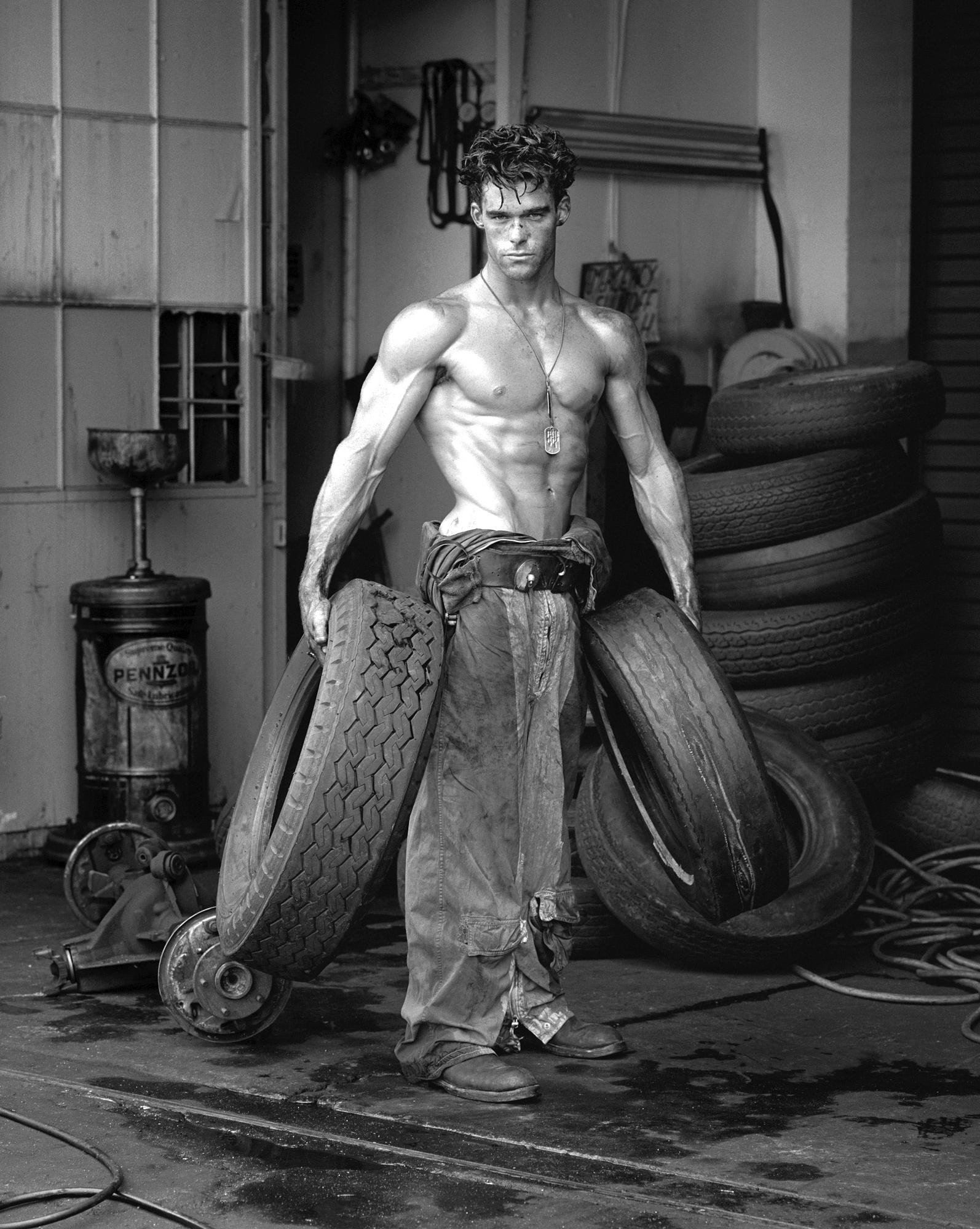 Fred with Tires, Hollywood - Photograph by Herb Ritts