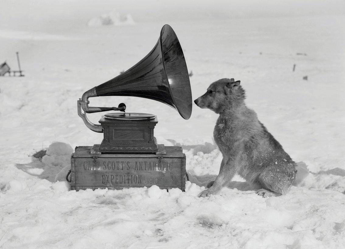 Chris and the Gramophone - Herbert George Ponting (Black and White Photography)
Stamped with Scott Polar Research Institute blind stamp and numbered on reverse
Platinum print
20 x 14 inches
From an edition of 30

Herbert Ponting (1870-1935) was